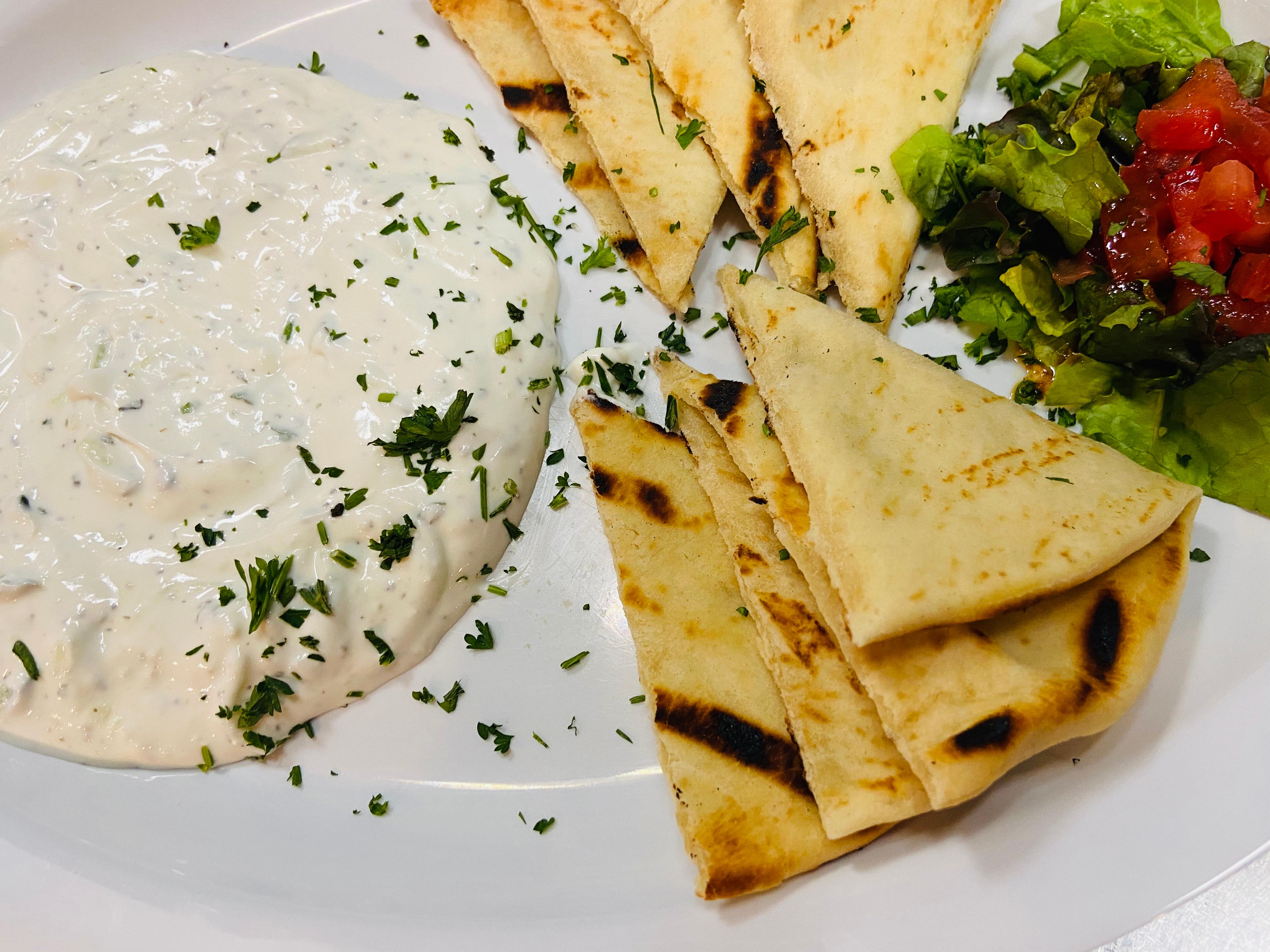 Order Tzatziki & Pita Appetizer food online from Off The Boat Fish Grill store, Placentia on bringmethat.com