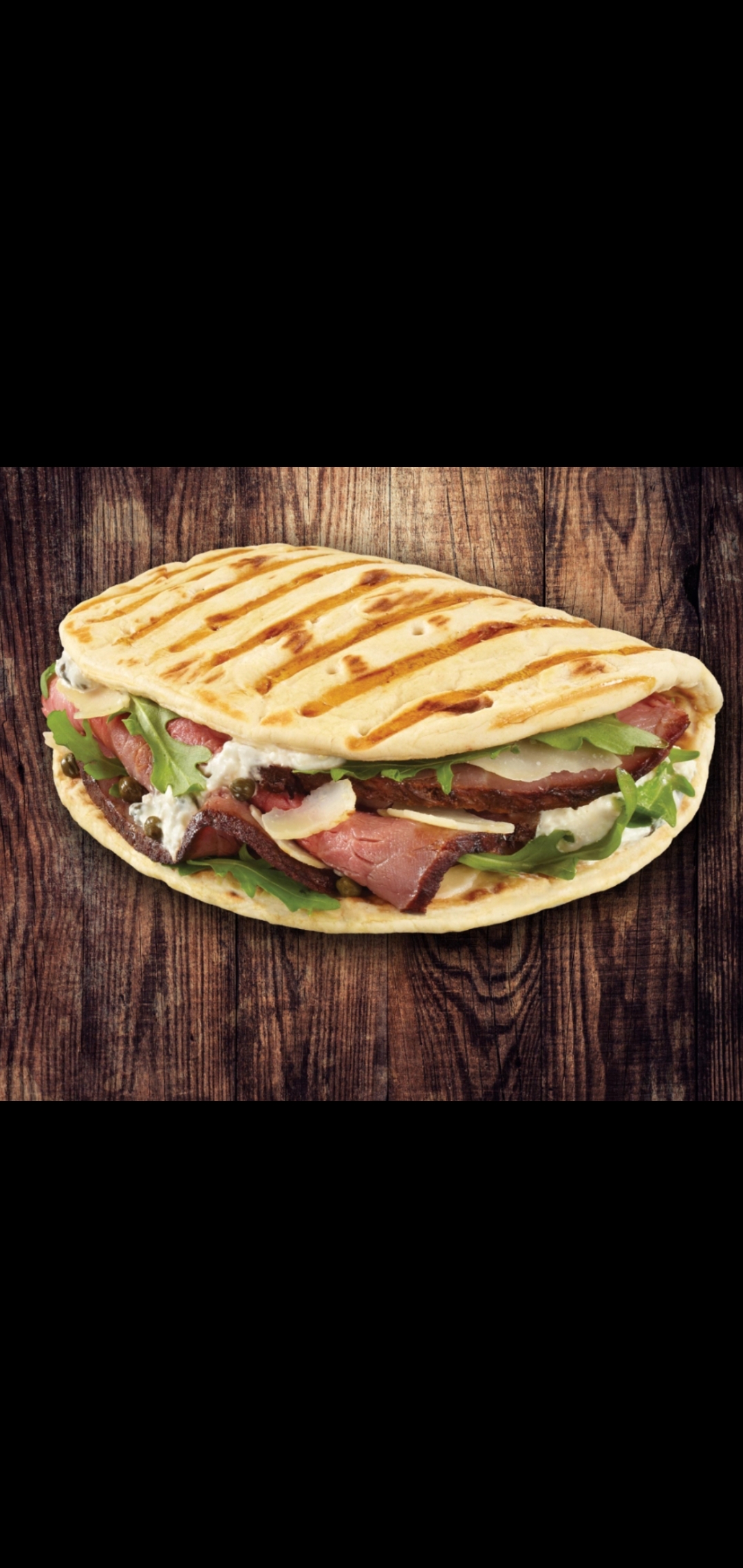 Order  Roast Beef Melt Cheese Panini ( roast beef melted cheese lettuce & tomatoes) food online from American Gourmet Foods Deli store, New York on bringmethat.com