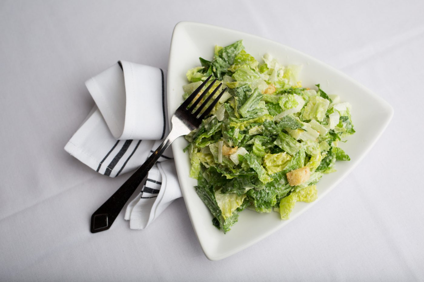 Order individual Caesar Salad food online from Piccola Italia Ristorante store, Manchester on bringmethat.com