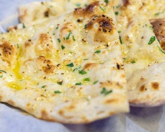 Order Garlic Naan food online from Paradise Indian Cuisine store, Manchester on bringmethat.com