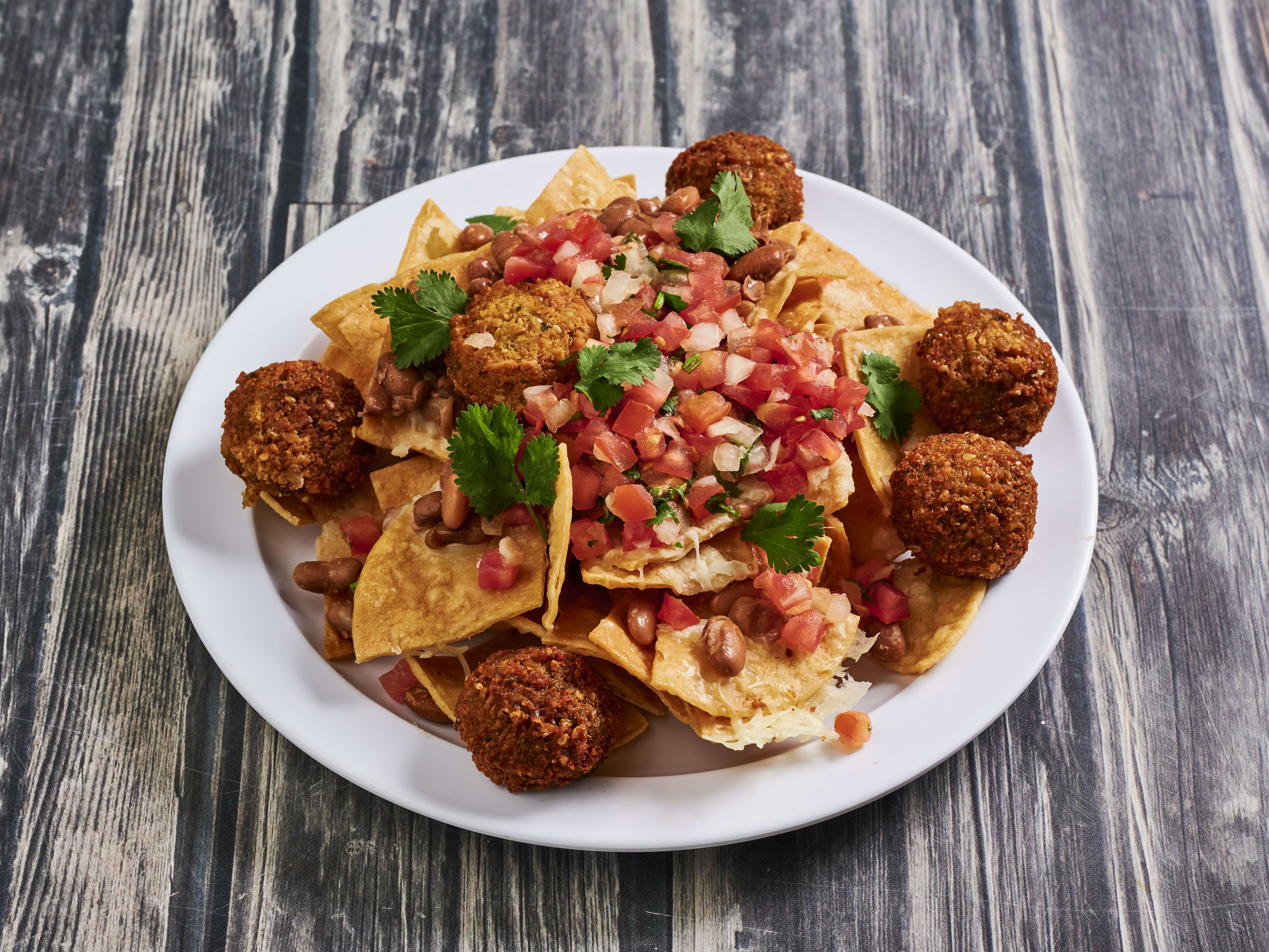 Order Nachos food online from Torshi Mexiterranean store, San Francisco on bringmethat.com