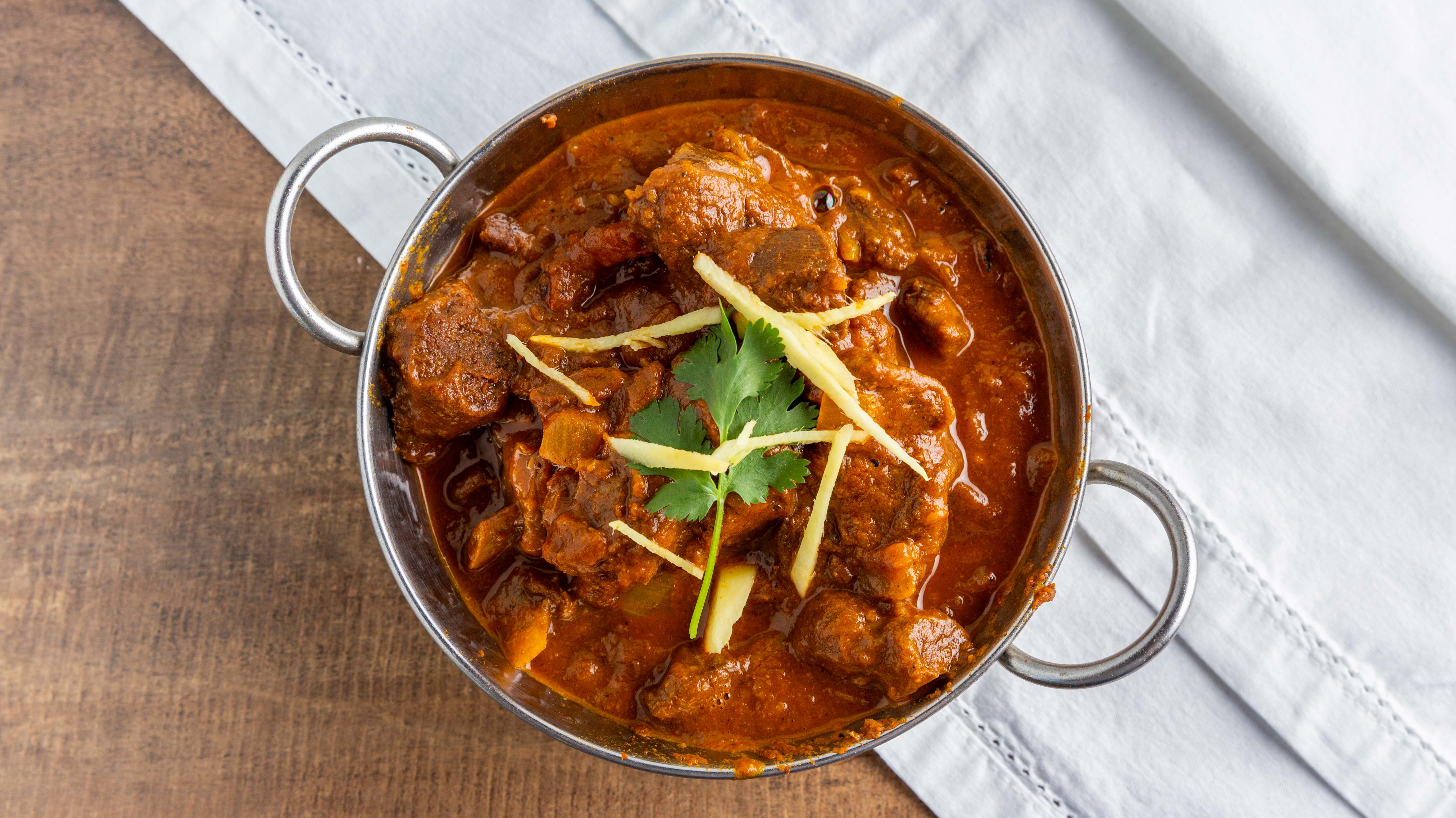 Order Goat Curry food online from Sattva Indian Rasoi store, Mission Viejo on bringmethat.com