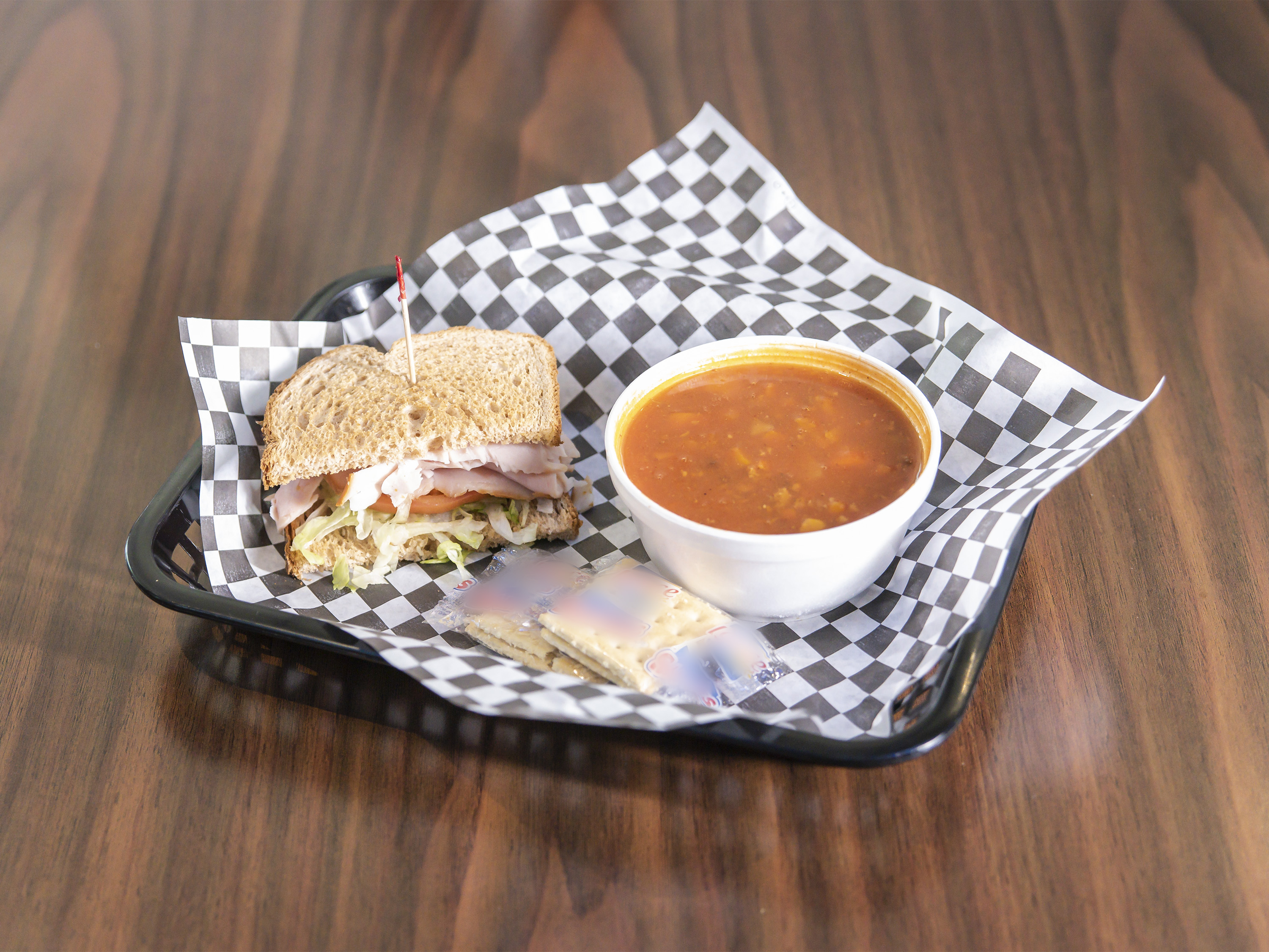 Order 35. Bowl of Soup and 1/2 Sandwich food online from Downtown Deli store, Winston Salem on bringmethat.com