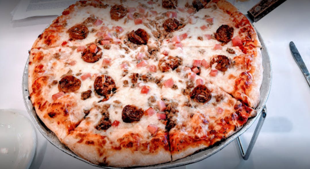 Order Meat Lovers Pizza - Medium 12" food online from Lasagna House III store, Houston on bringmethat.com