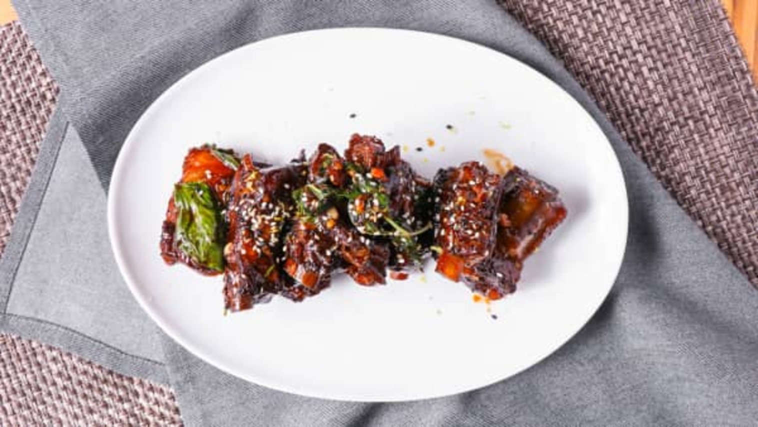 Order Tamarind Laced Sweet & Sour Basil Glazed Pork Ribs food online from China Live store, San Francisco on bringmethat.com