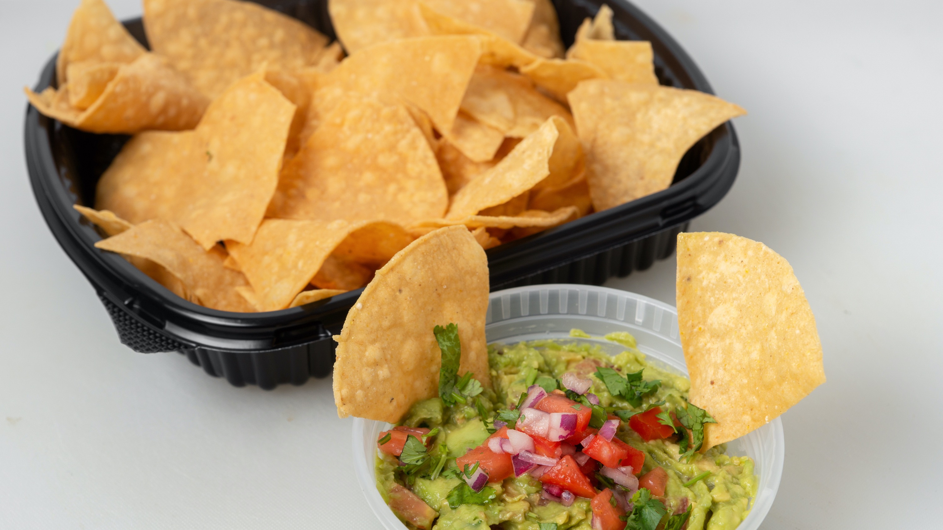 Order Large Guacamole ＆ Chips food online from Tacos Panchito store, Corona on bringmethat.com