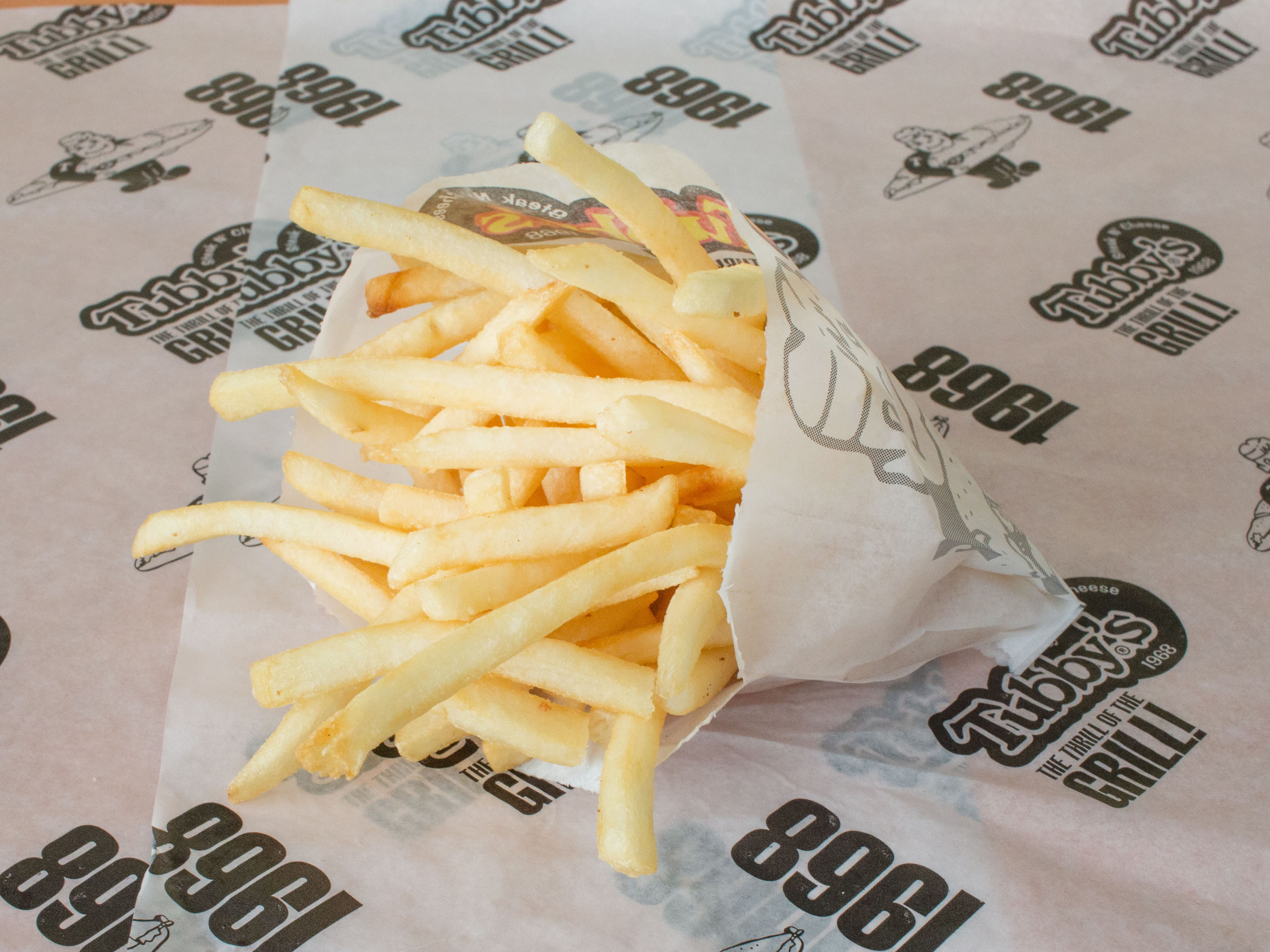 Order French Fries food online from Tubby Sub Shop store, Madison Heights on bringmethat.com