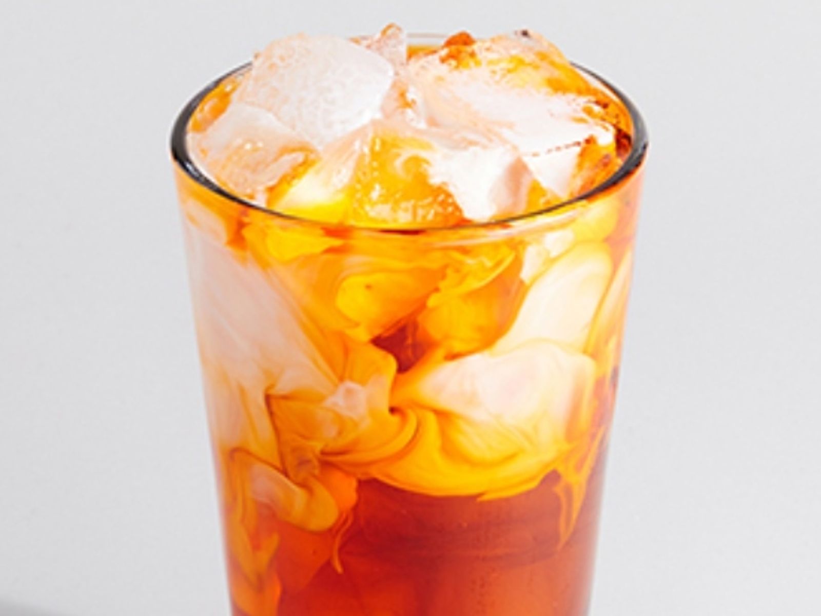 Order Thai Iced Tea food online from Sweetwaters Coffee & Tea store, Shelby Charter Township on bringmethat.com