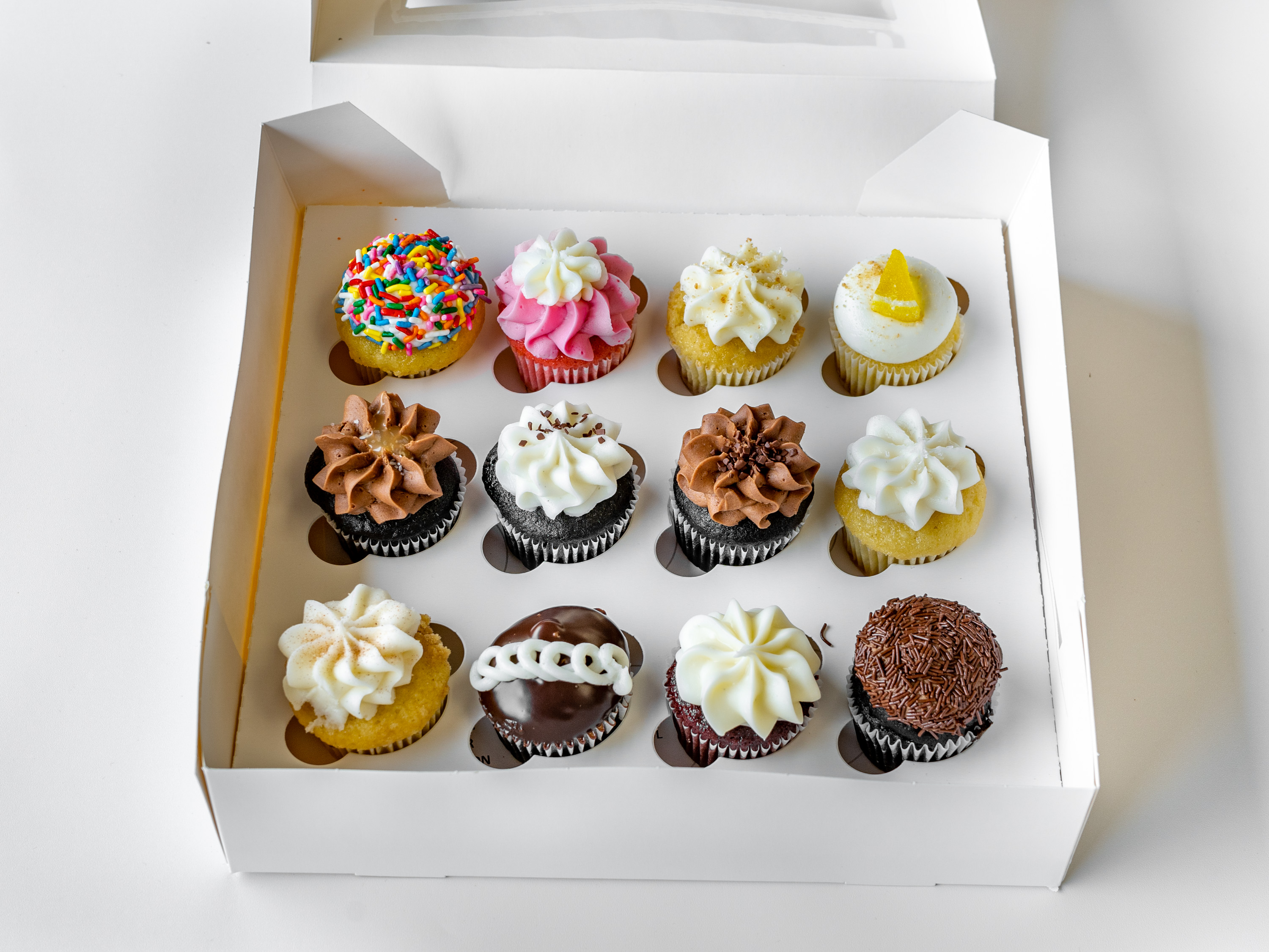 Order 1 Dozen Assorted Mini Cupcakes food online from Yummy Cupcakes store, Encinitas on bringmethat.com