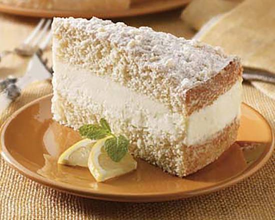 Order Lemon Crème Cake food online from Johnny Carino store, El Paso on bringmethat.com