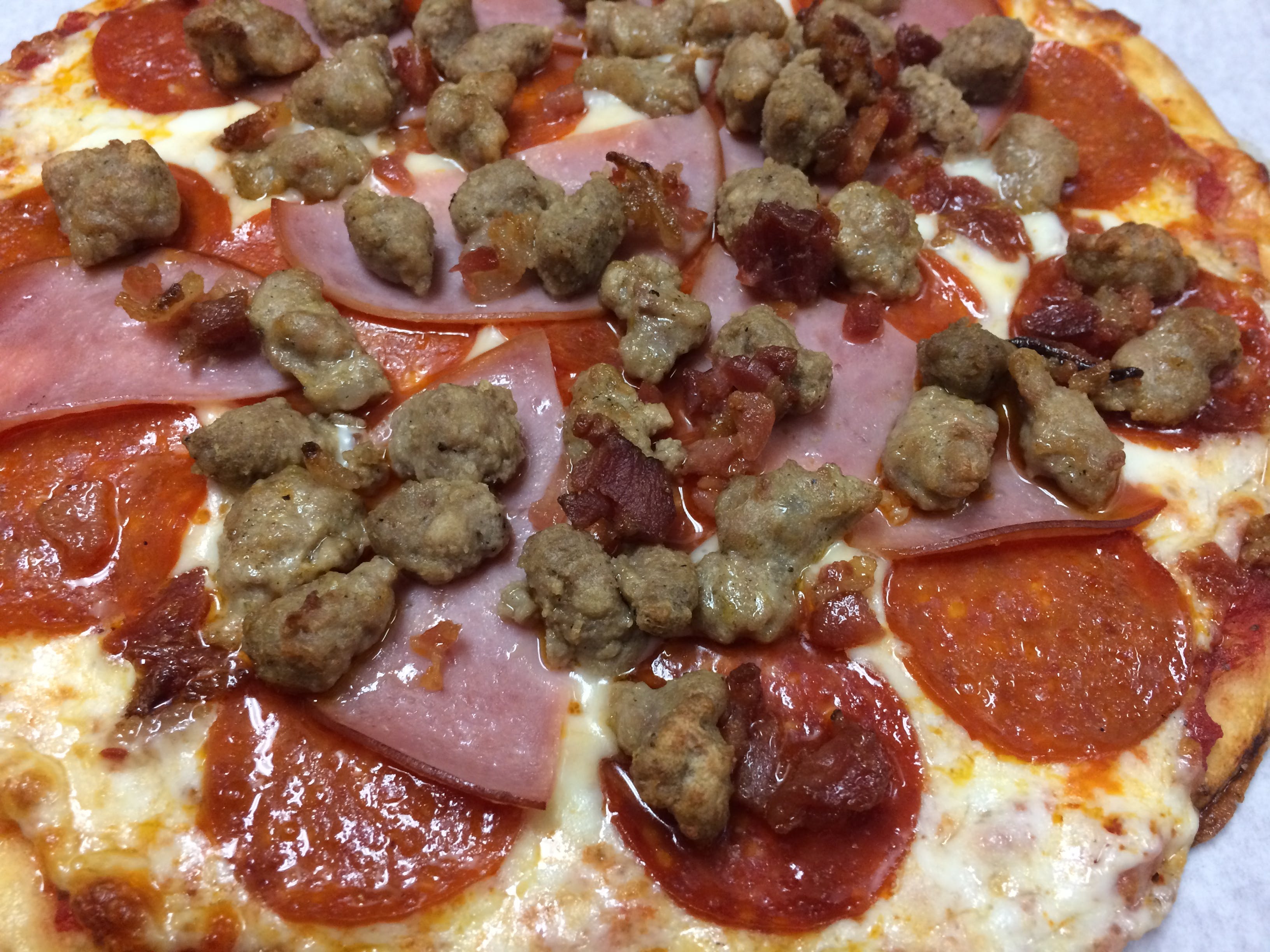 Order Meat Lover's Pizza - Small food online from I pizza store, Newark on bringmethat.com