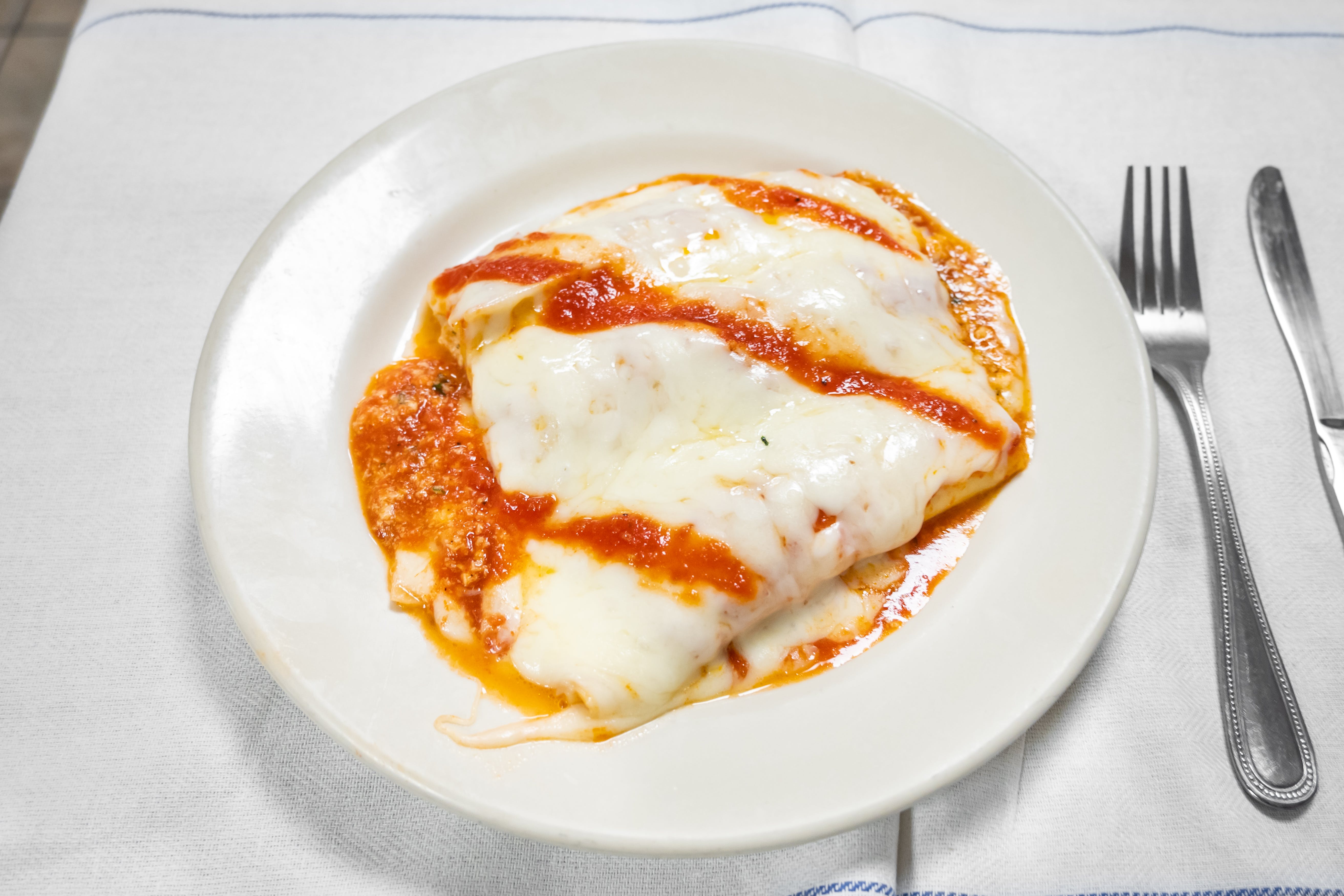 Order Baked Manicotti - 3 Pieces food online from Me & U Pizzeria store, Deptford Township on bringmethat.com