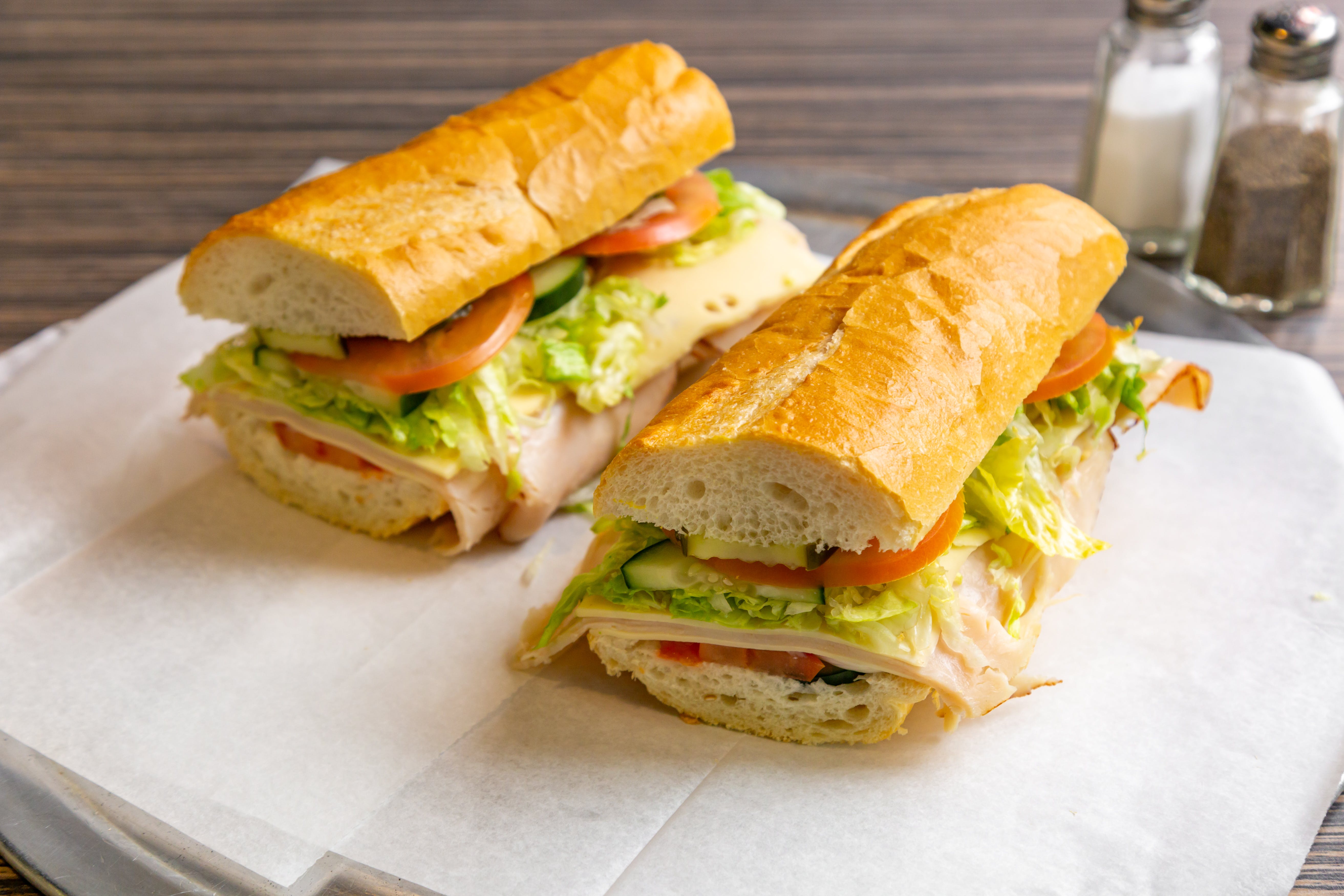 Order Turkey Sub - Sub food online from Art of Pizza on State Street store, Chicago on bringmethat.com