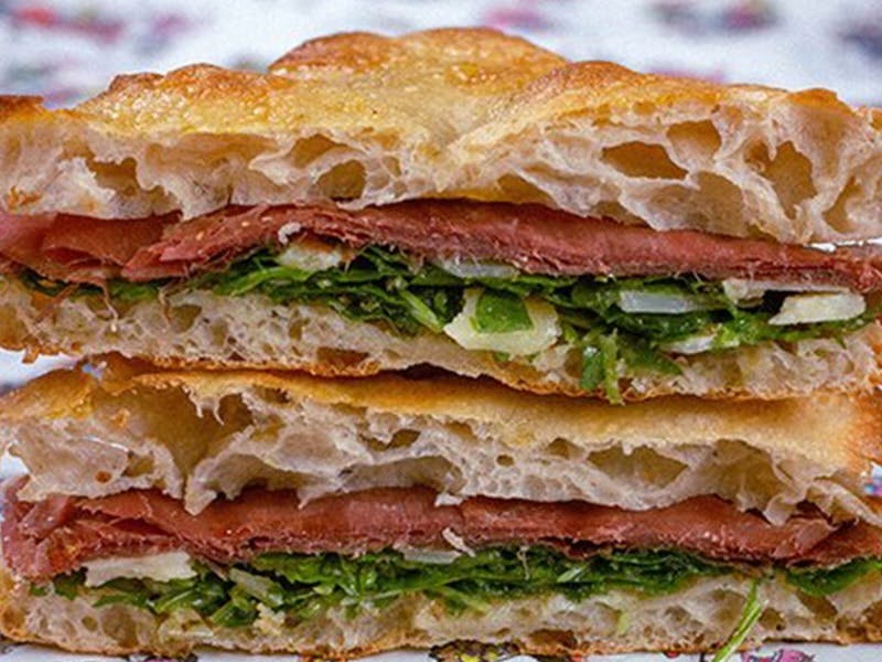Order Bresaola Arugula Parmigiano Sandwich - Half food online from Chill Since 93 store, Los Angeles on bringmethat.com