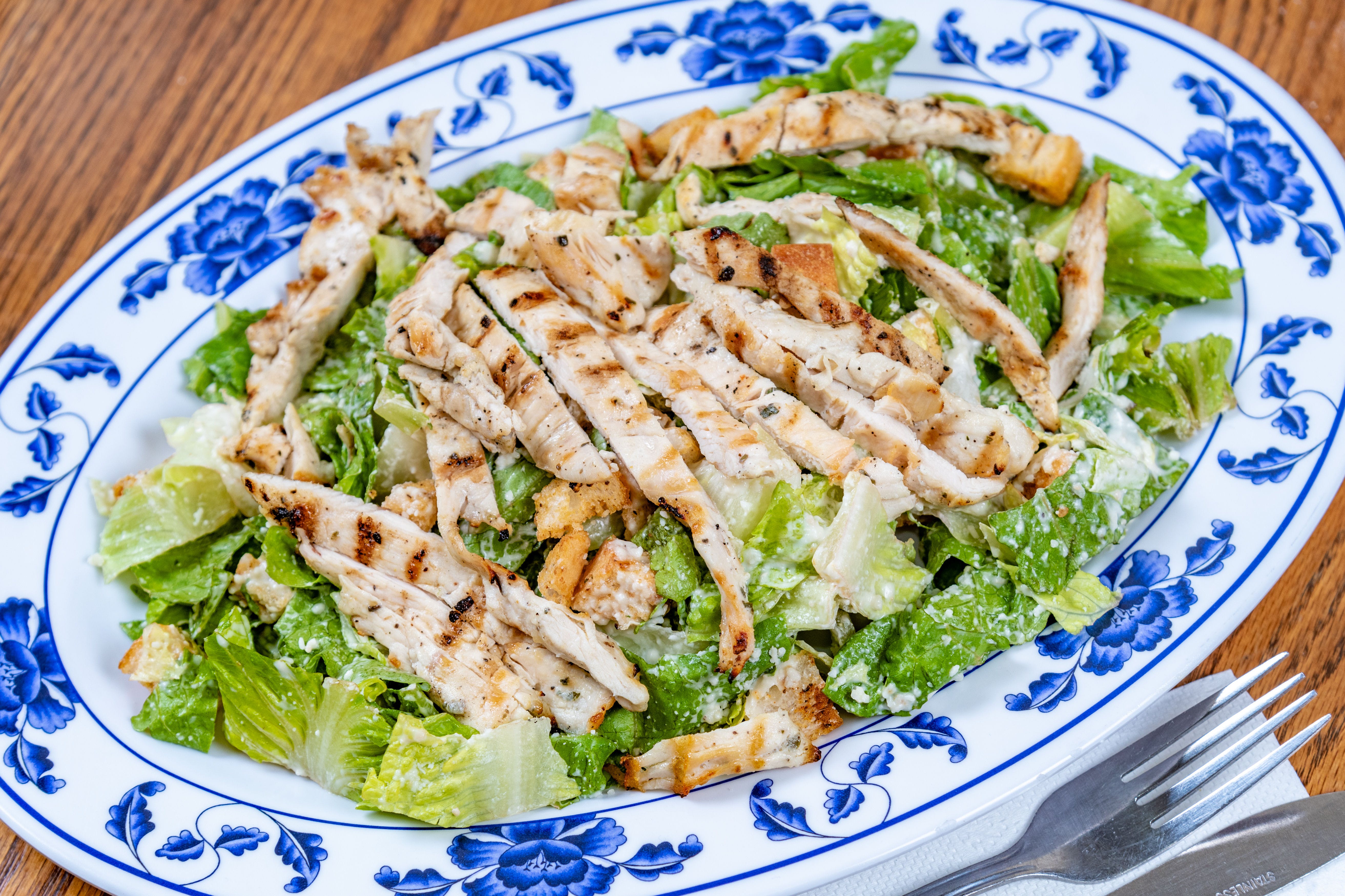 Order Grilled Chicken Caesar Salad - Salad food online from La Casa Mia Pizzeria & Restaurante store, Brooklyn on bringmethat.com