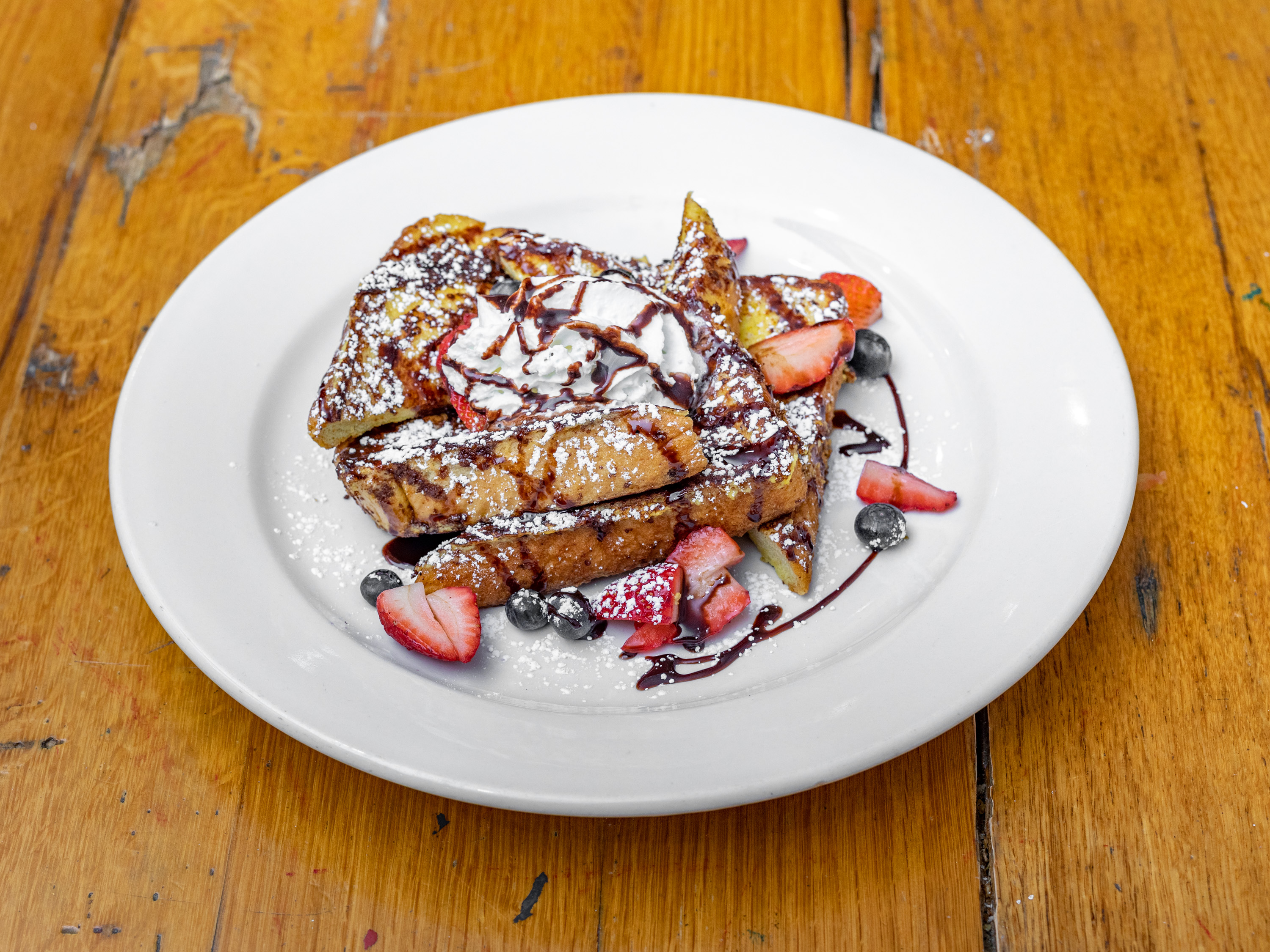 Order FRENCH TOAST WITH FRUIT food online from Thiago's Restaurant store, Chicago on bringmethat.com