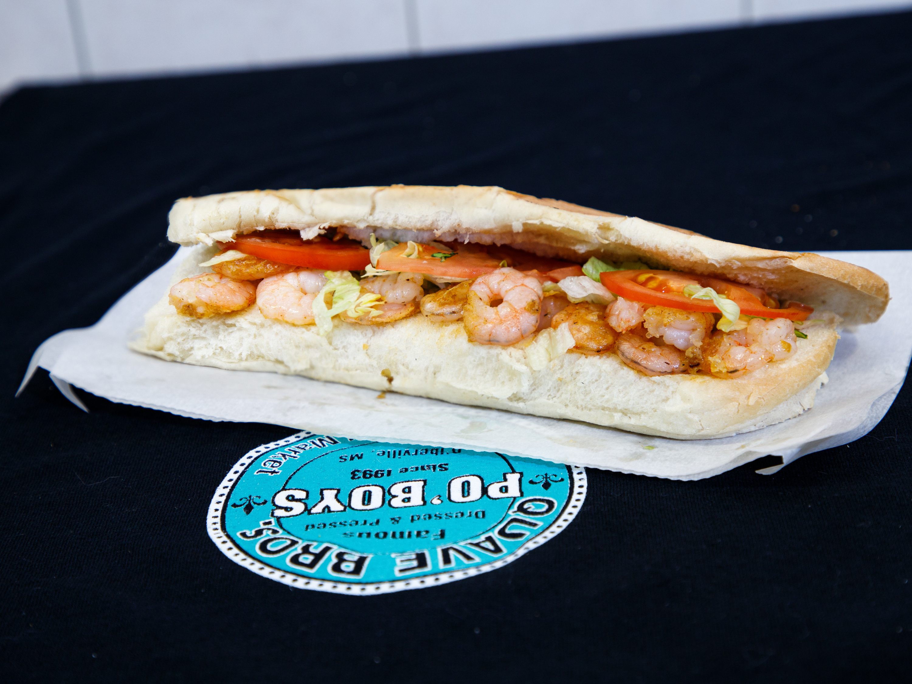 Order 16" Shrimp NOLA Style Po'Boy food online from Quave Brothers Poboys and Meat Market store, Diberville on bringmethat.com