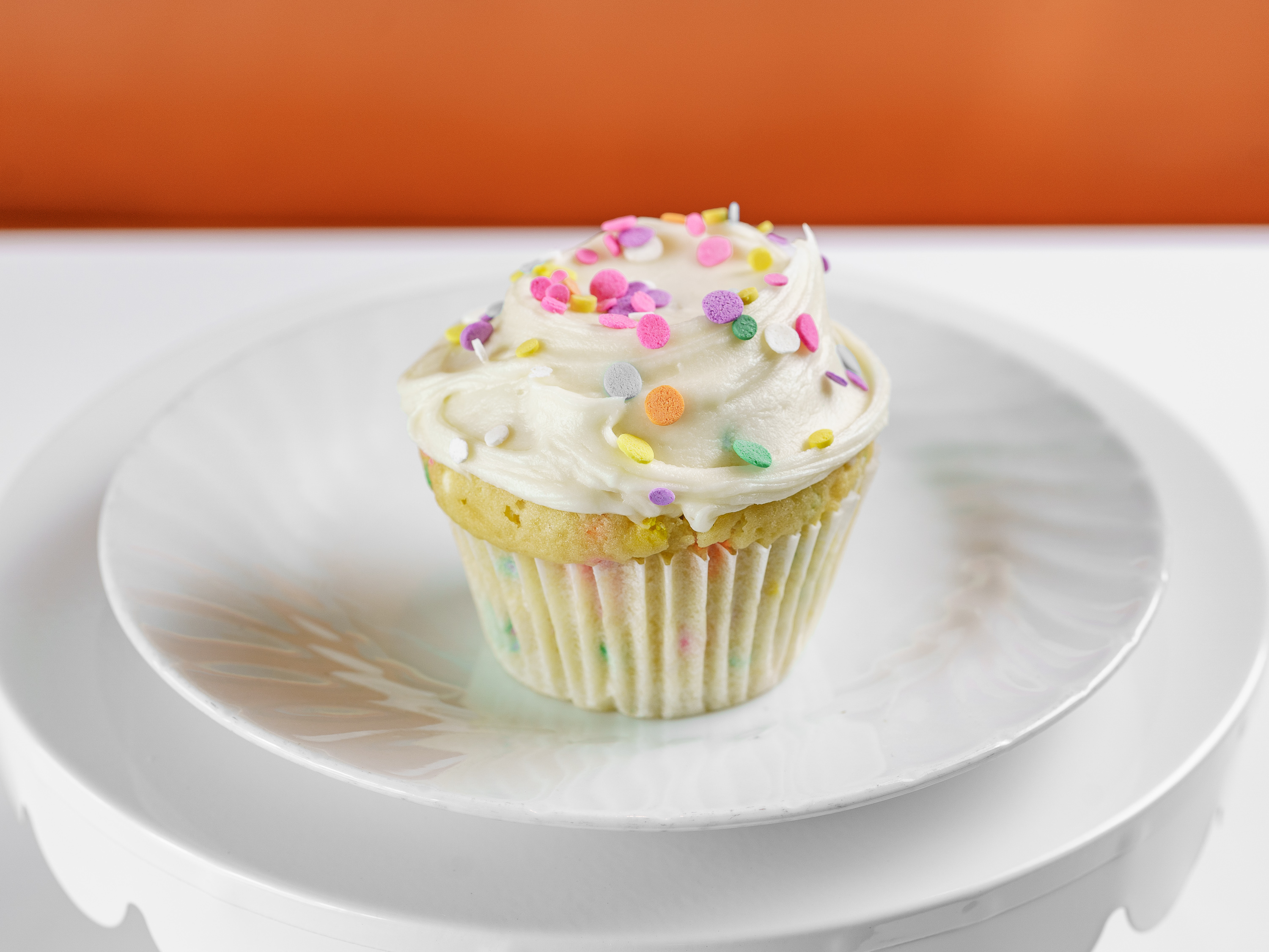 Order Confetti / Vanilla Buttercream Cupcake food online from Frosted Cupcakery store, Long Beach on bringmethat.com