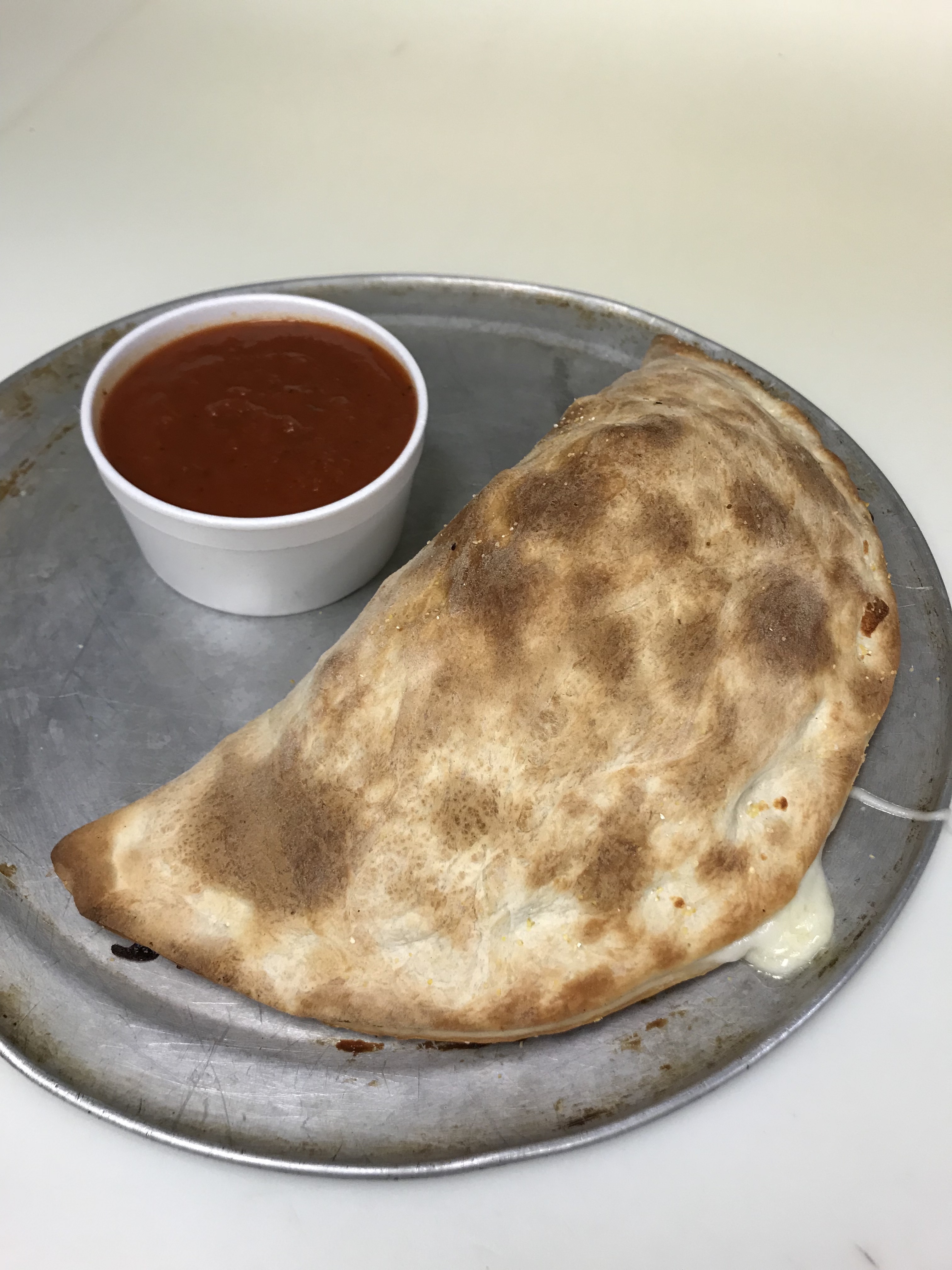 Order Calzone food online from Tortorice's Pizza & Catering store, Chicago on bringmethat.com
