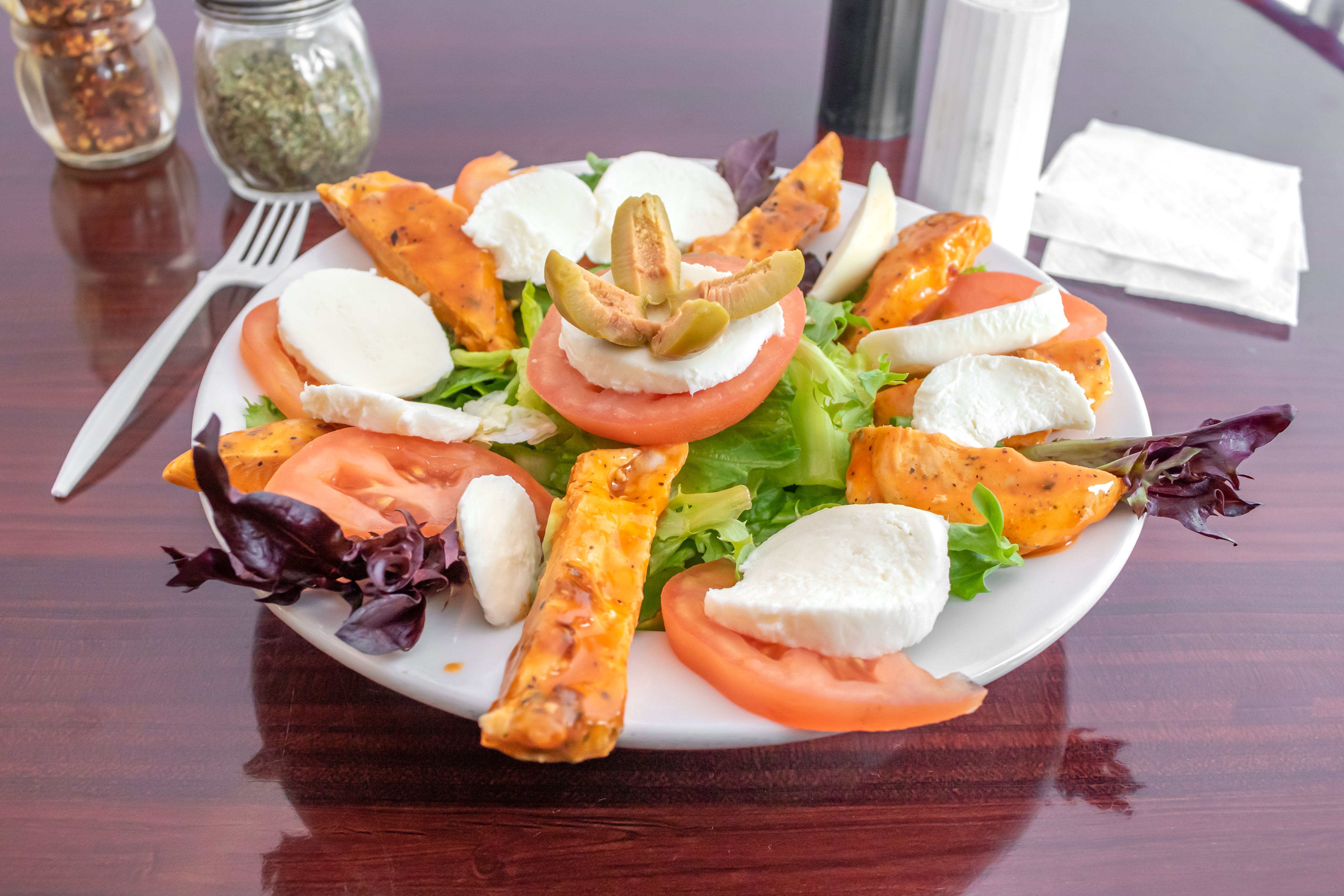 Order Buffalo Chicken Finger Salad - Small food online from Dominics Pizza and Restaurant store, Lawrence Township on bringmethat.com