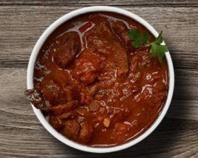 Order Simple Goat Curry food online from Biryani Factory store, Youngstown on bringmethat.com
