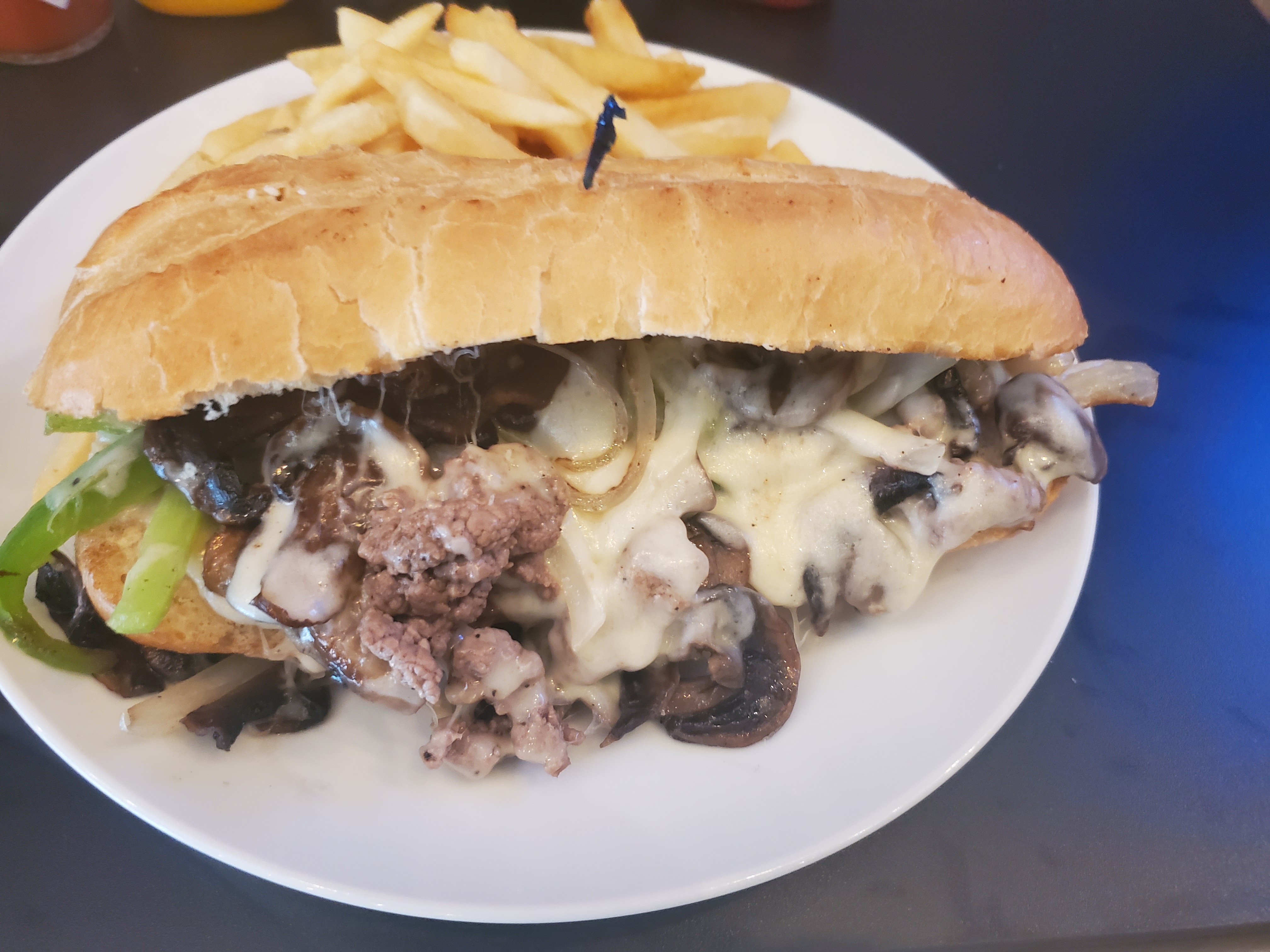 Order Philly Cheese Steak Sandwiche food online from Flippers Gourmet Burgers store, San Francisco on bringmethat.com
