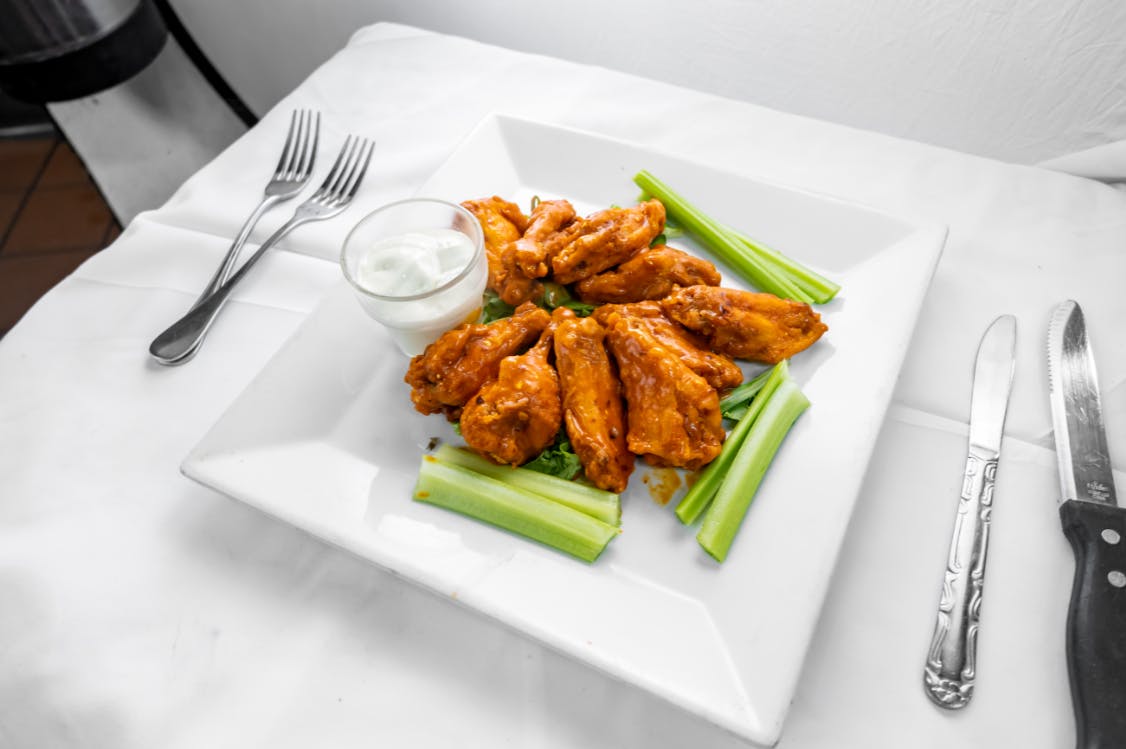 Order Buffalo Wings - Appetizer food online from Alessios Seafood Grille store, Warrington on bringmethat.com