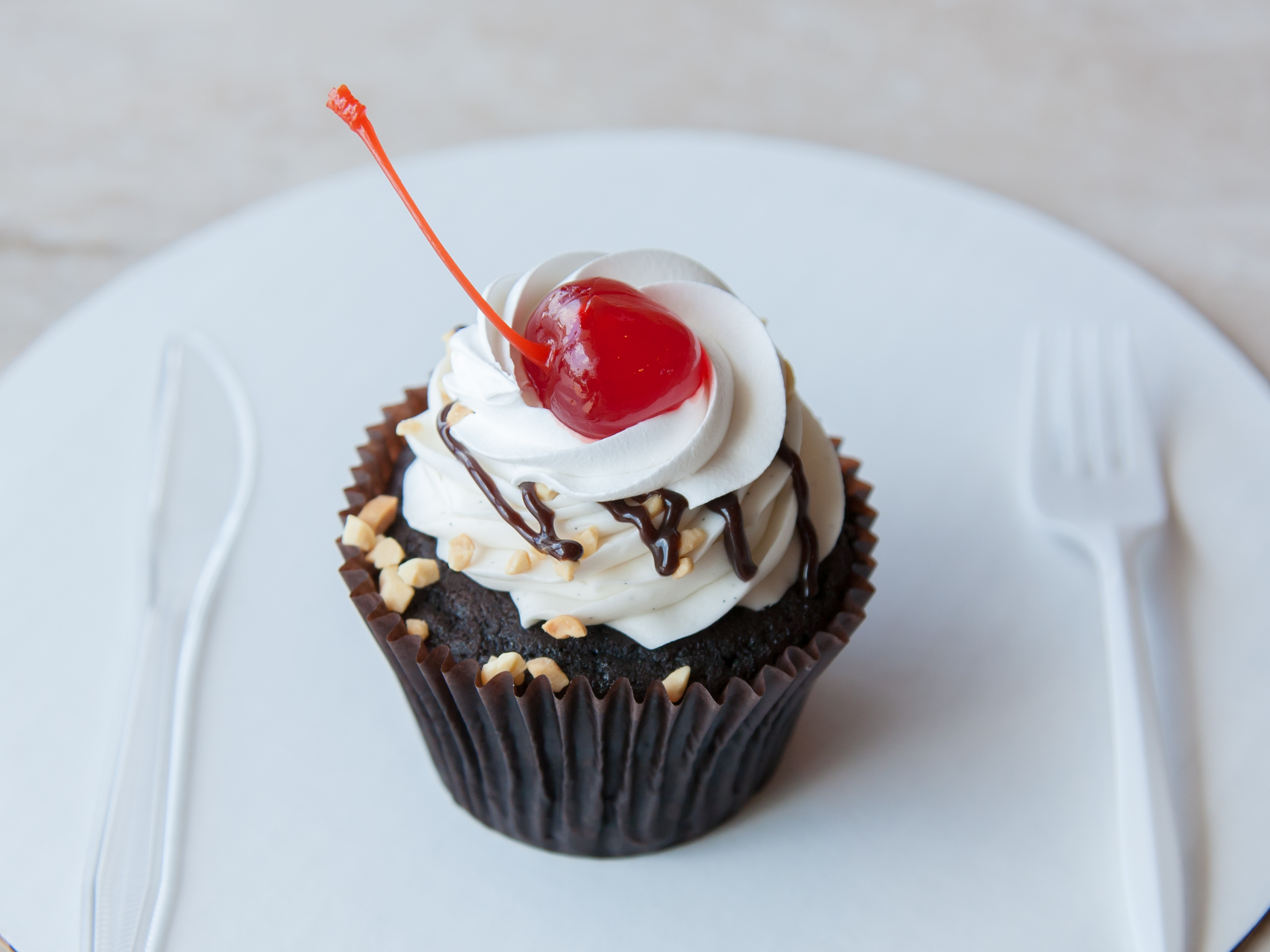 Order Hot Fudge Sundae Cupcake food online from Smallcakes store, Naperville on bringmethat.com