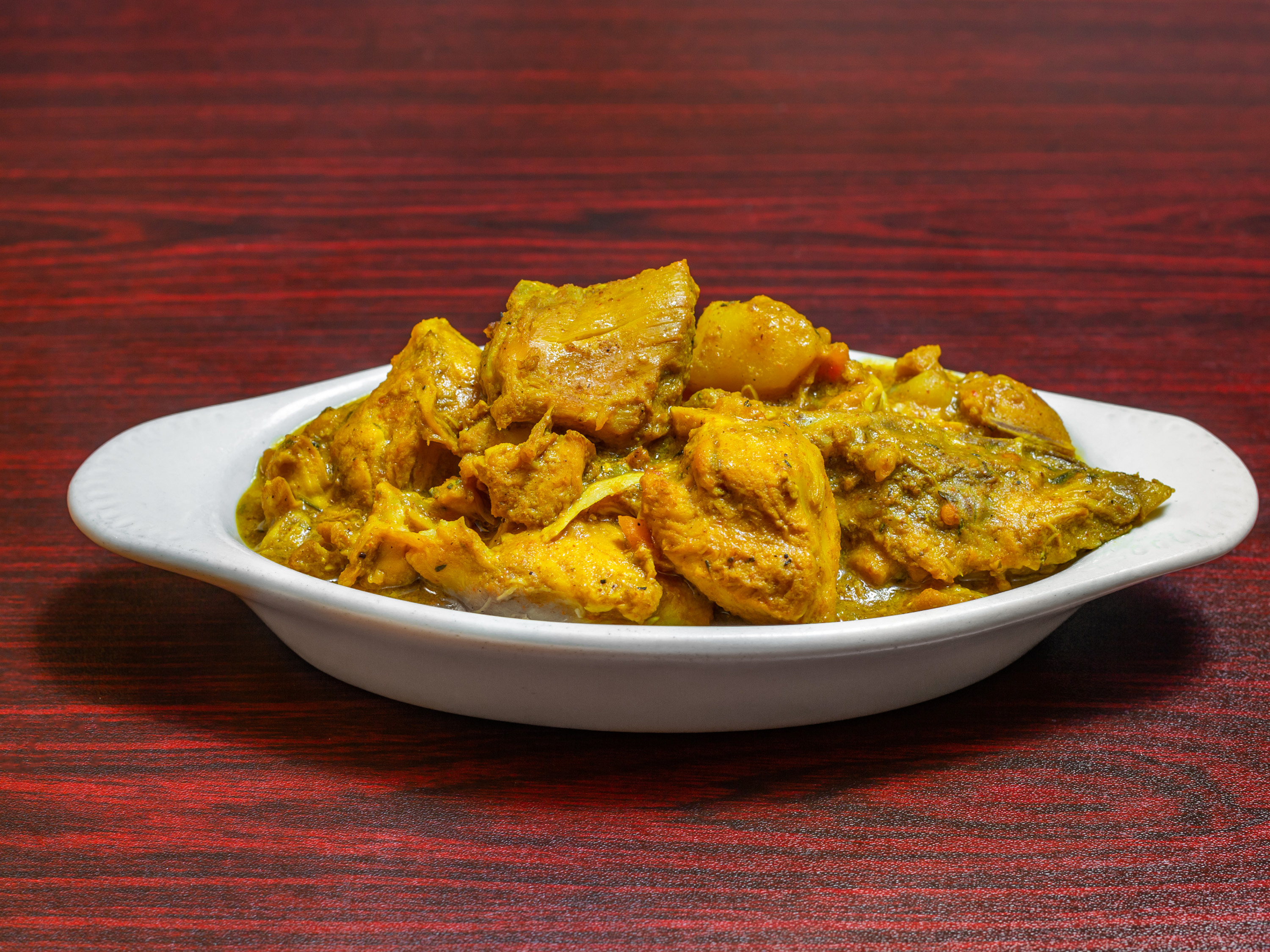 Order Mama's Curry Chicken Only food online from Malakhi Lounge & Jamaican Restaurant store, Manassas on bringmethat.com