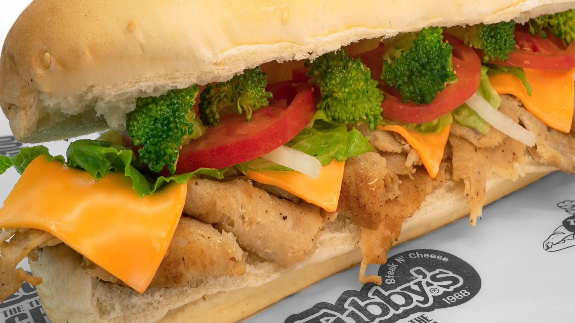 Order Chicken & Broccoli Sub - Small food online from Tubby's Grilled Submarines store, Westland on bringmethat.com