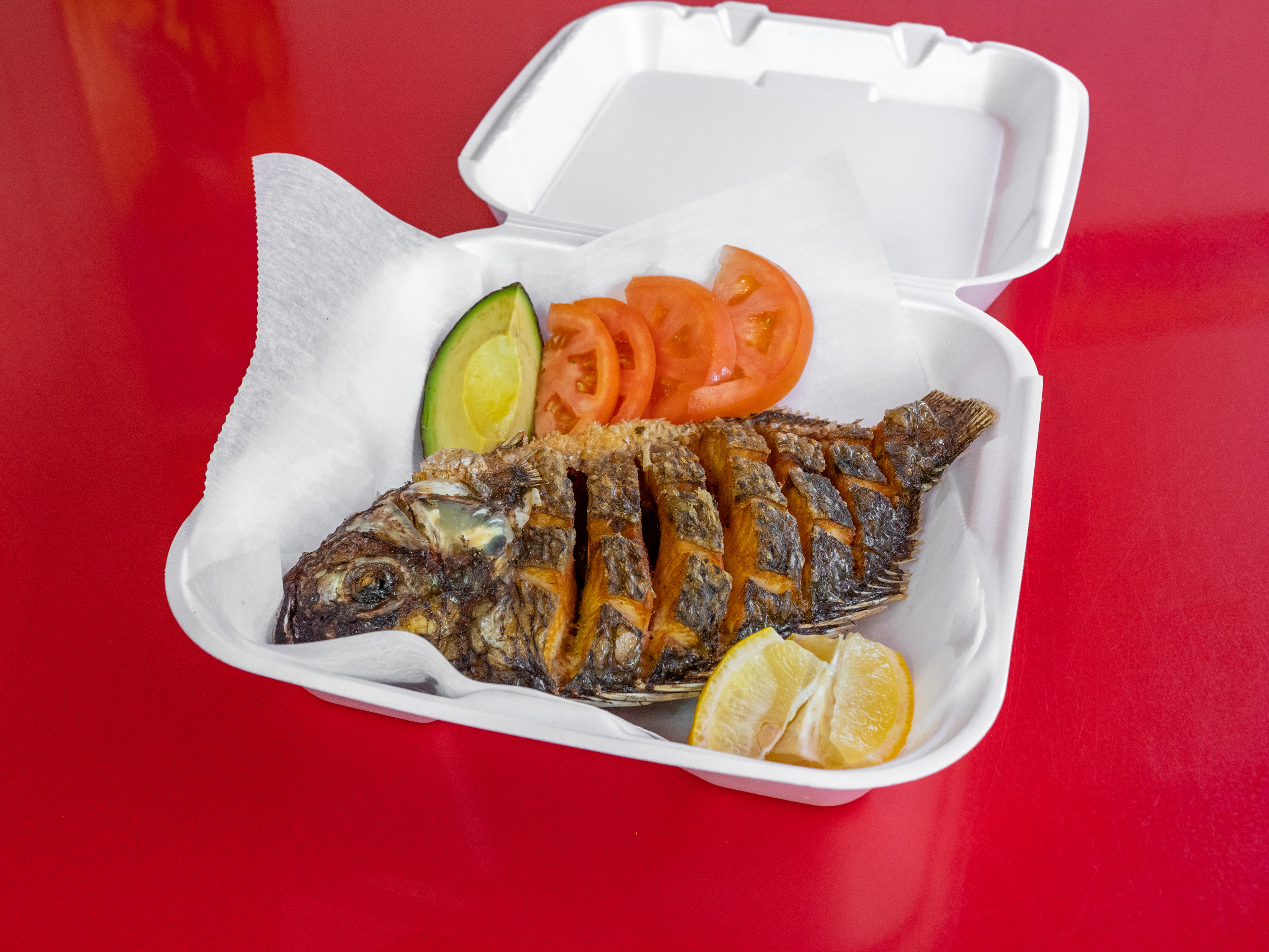 Order 8. Tilapia Frita food online from Antojitos Colombianos store, Manchester on bringmethat.com