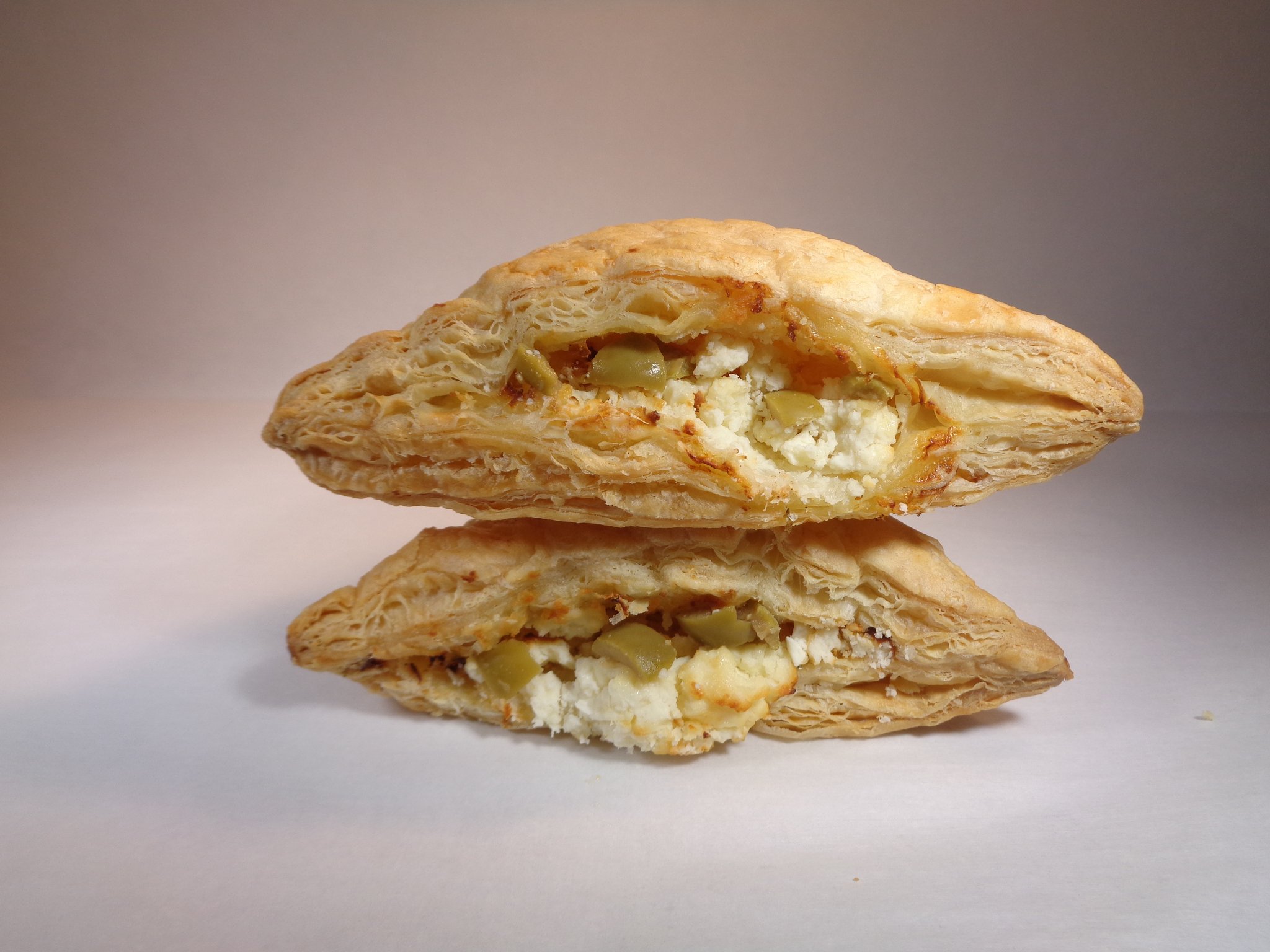 Order Feta Cheese & Green Olives Puff Pastry - 2 Pieces food online from Lema Bakery store, Houston on bringmethat.com