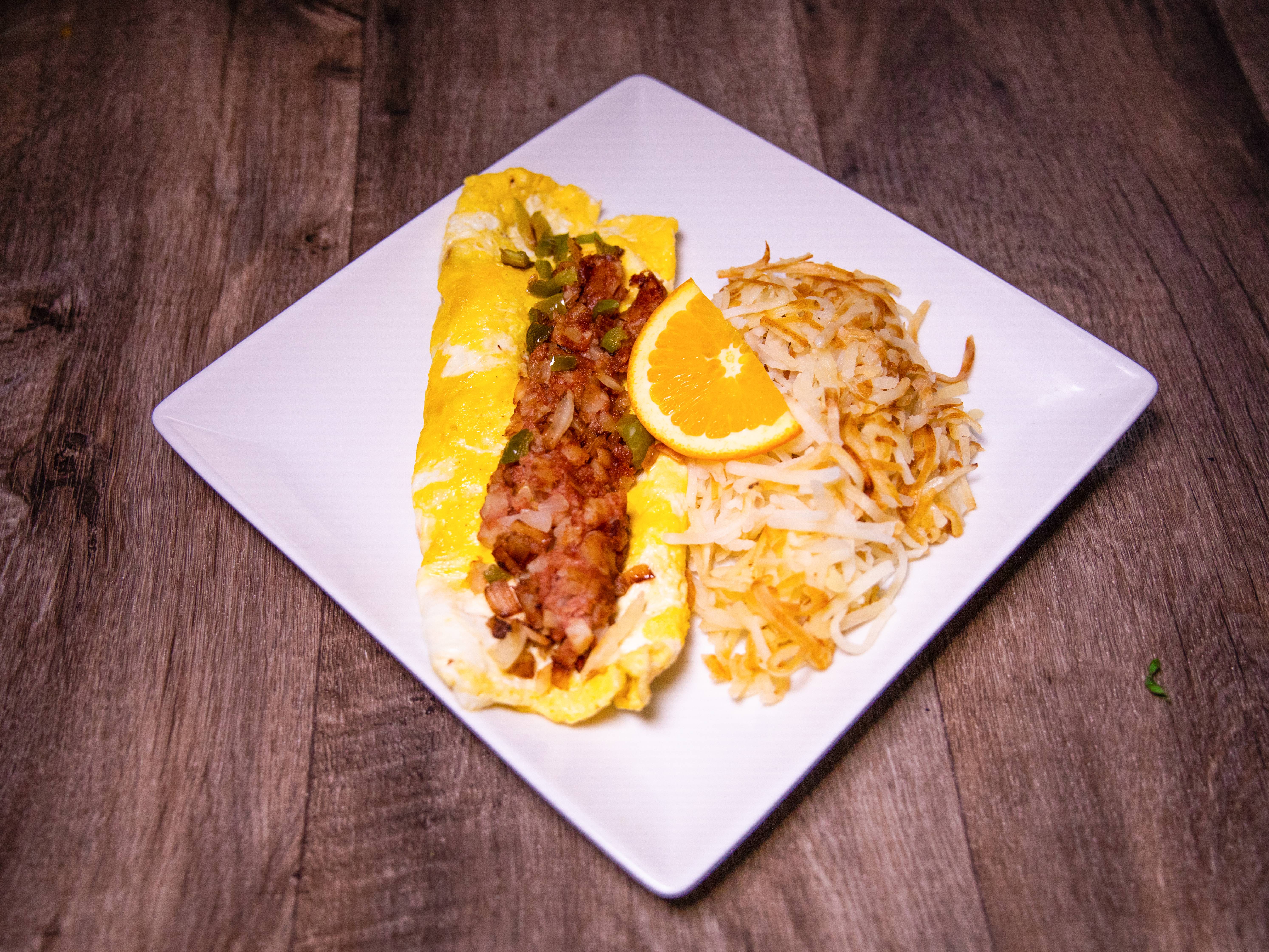 Order 25. Corn Beef Omelet  food online from Midtown Bar & Grill store, Houston on bringmethat.com