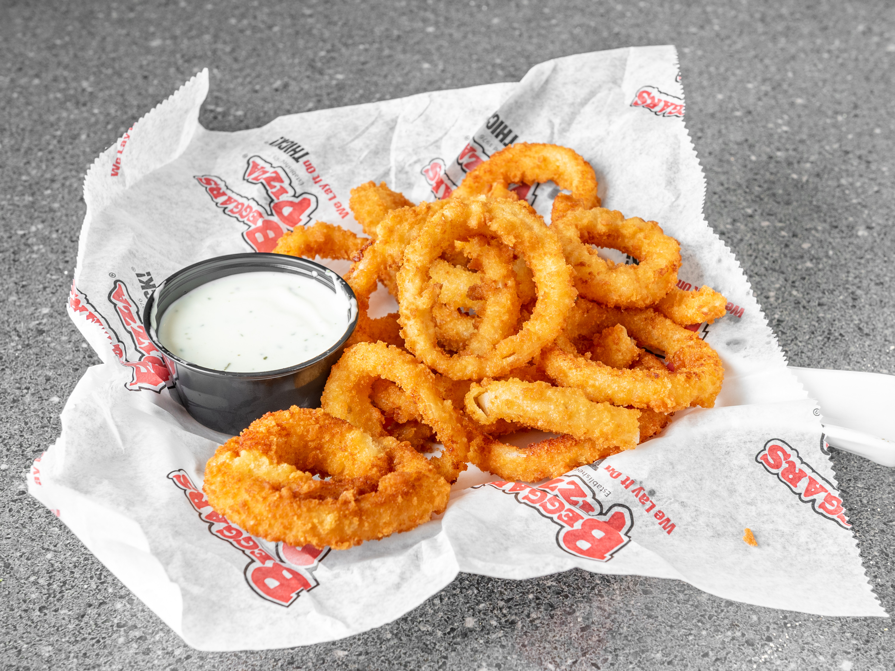 Order Onion Rings food online from Beggars Pizza store, Bolingbrook on bringmethat.com
