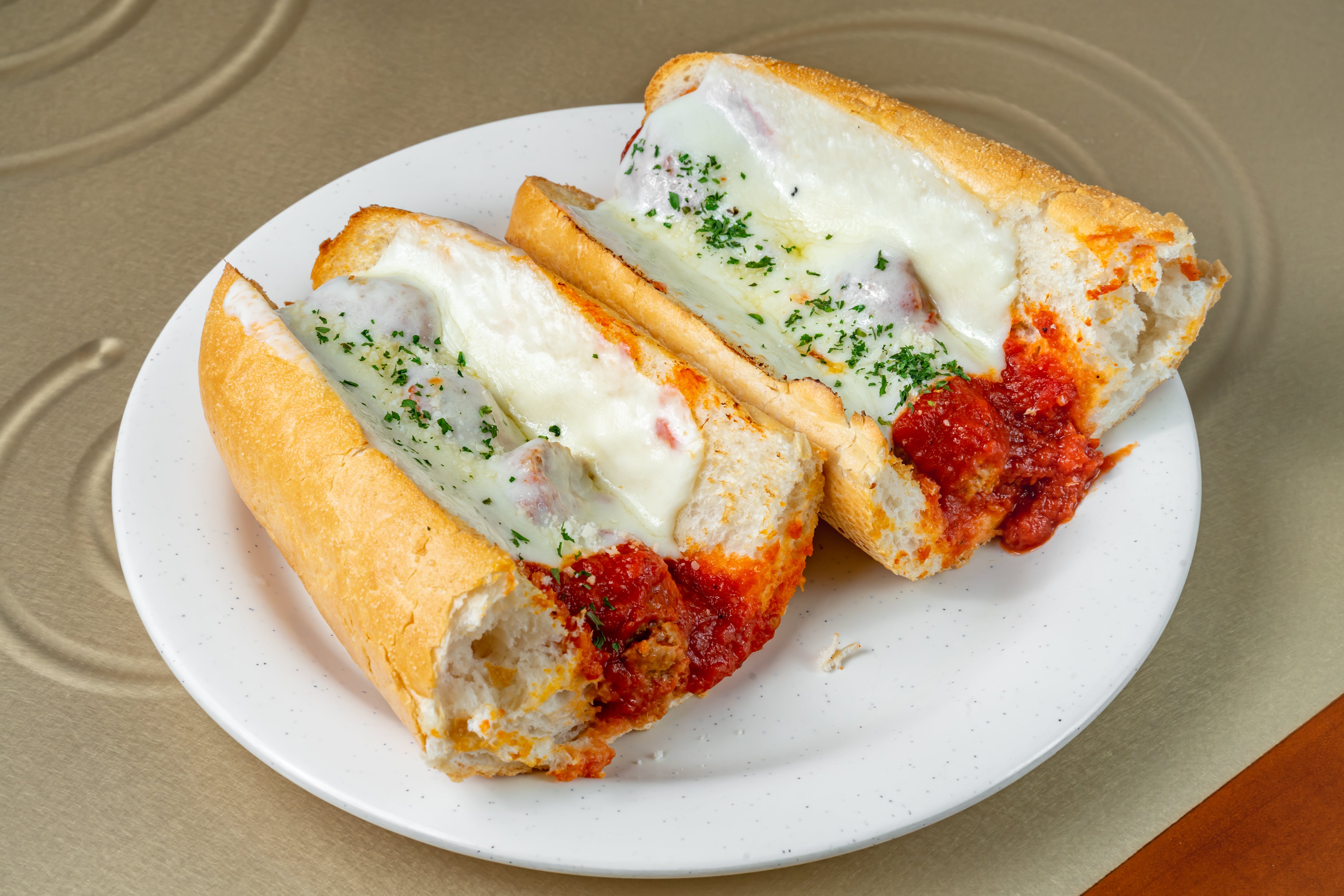 Order Meatball Parmesan Sub - 12" food online from New York Pizzeria store, Grand Prairie on bringmethat.com