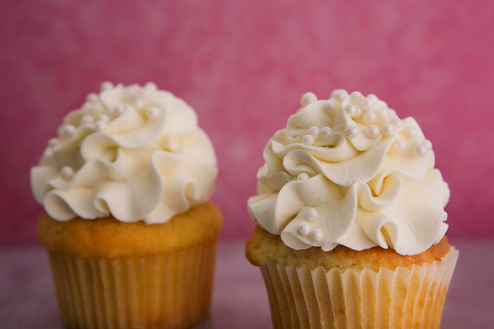 Order Vanilla Cupcakes food online from Destination Desserts store, St. Louis on bringmethat.com