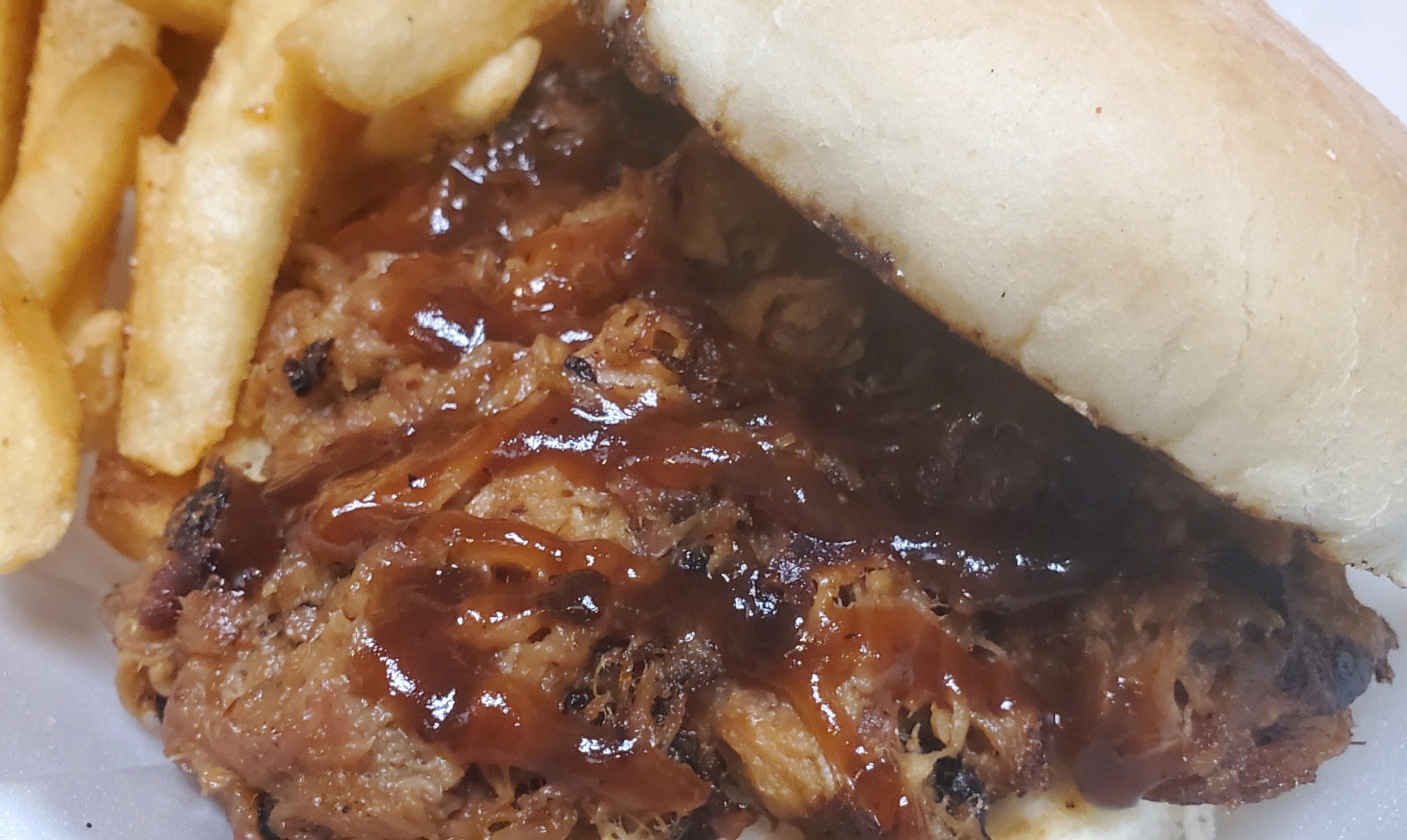 Order BBQ Pulled Pork Sandwich food online from Knuckles Knockout Grill store, Rochester on bringmethat.com
