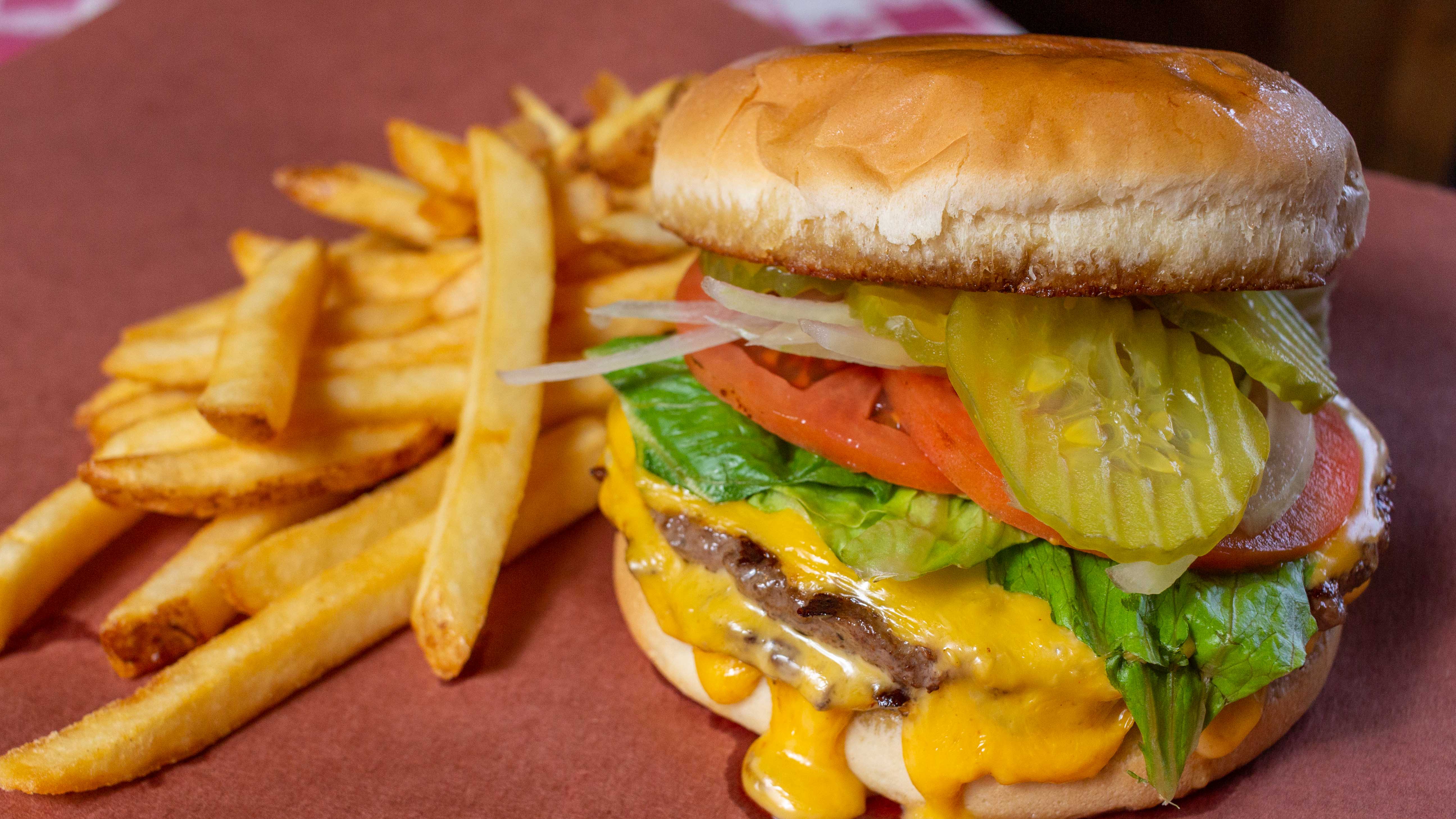 Order 1/2 lb. Cheeseburger and Fries food online from C&J Barbeque store, College Station on bringmethat.com