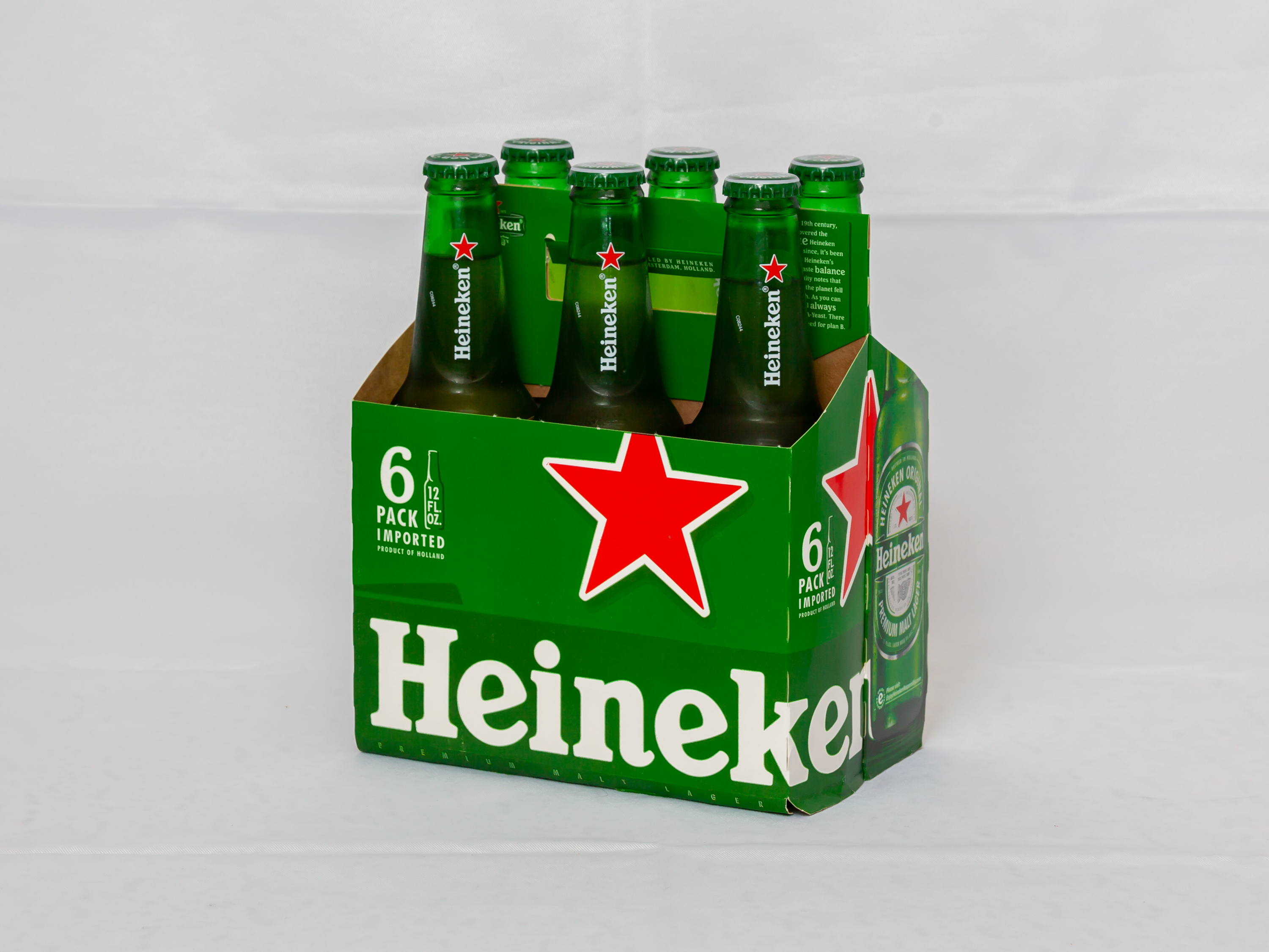 Order Heineken 6 Pack 12 OZ Bottles  food online from Country Club Hills Food And Liquor store, Country Club Hills on bringmethat.com