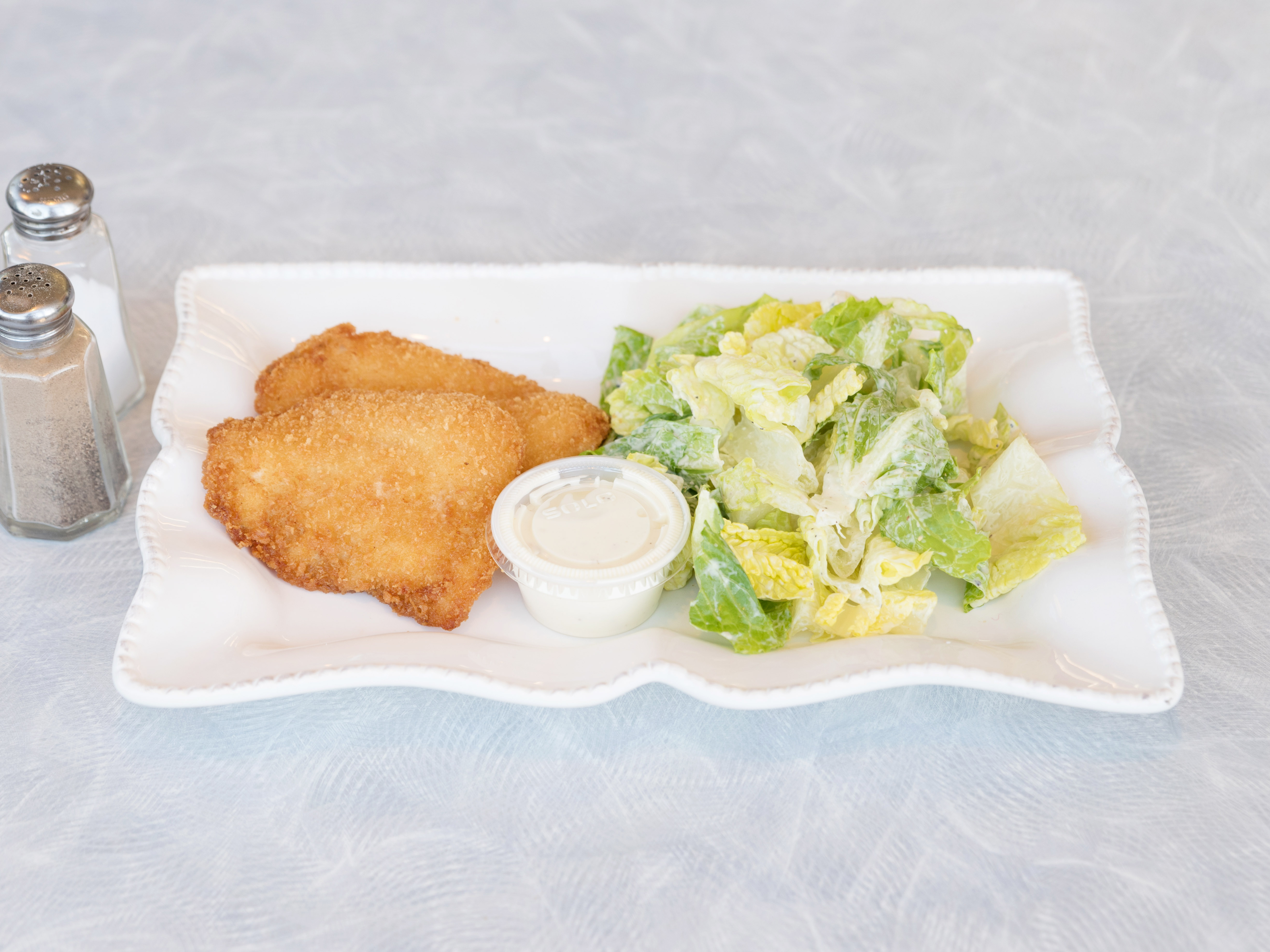 Order 2 Pieces Fish and Caesar Salad food online from By's store, Seattle on bringmethat.com