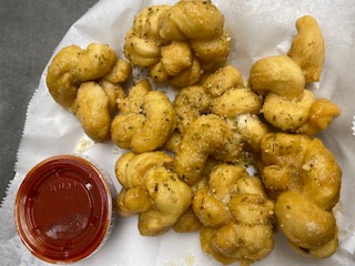 Order Garlic Parmesan Knots with Marinara food online from The Station Pizzeria store, Glenwood on bringmethat.com