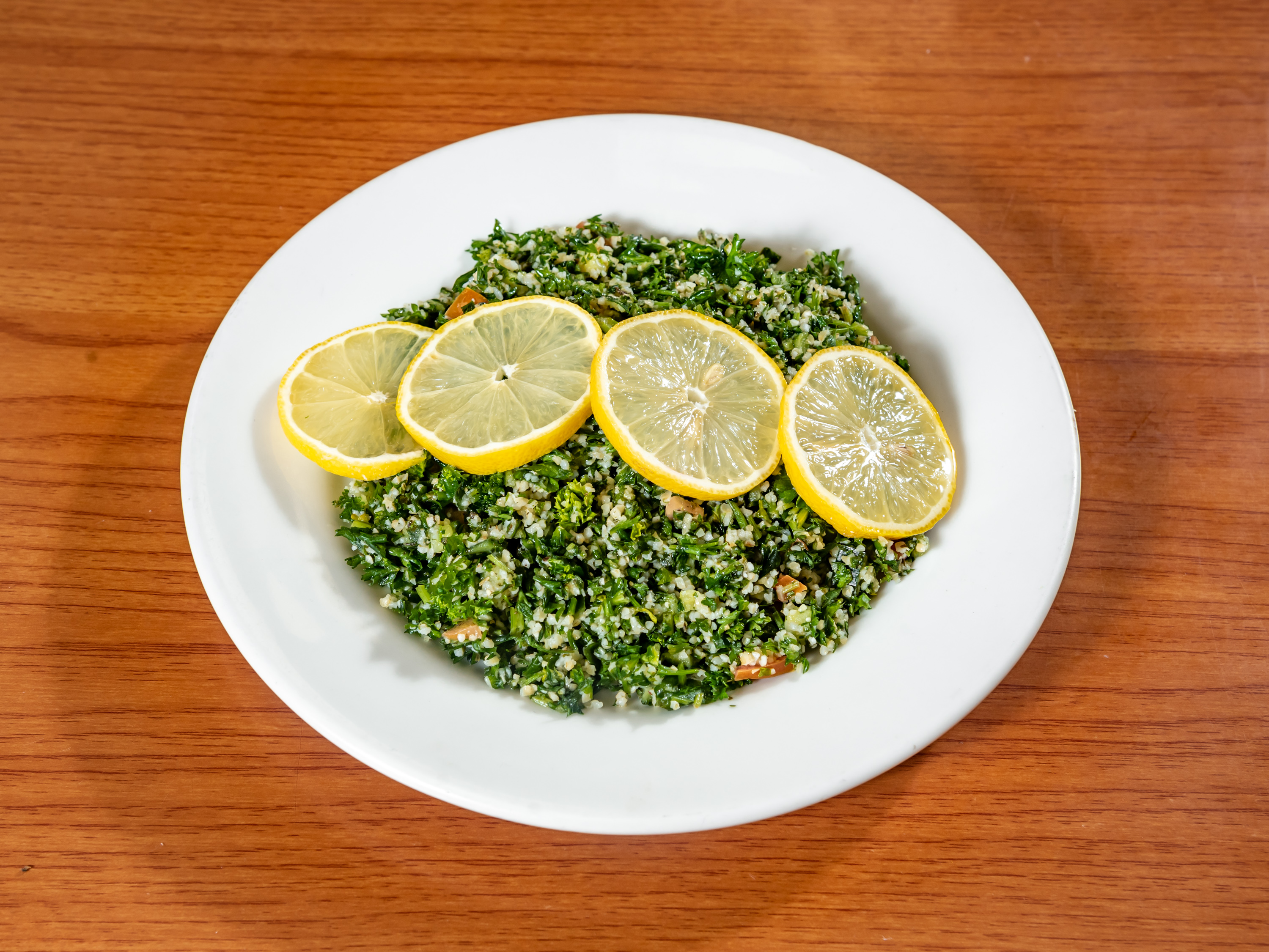 Order Tabouli Salad food online from Sahara Middle Eastern Eatery store, Albuquerque on bringmethat.com