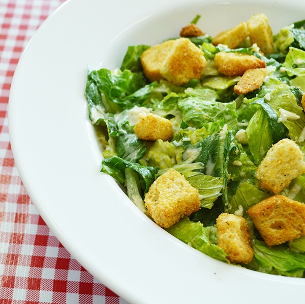 Order Caesar Salad food online from Combo's Pizza store, Fullerton on bringmethat.com