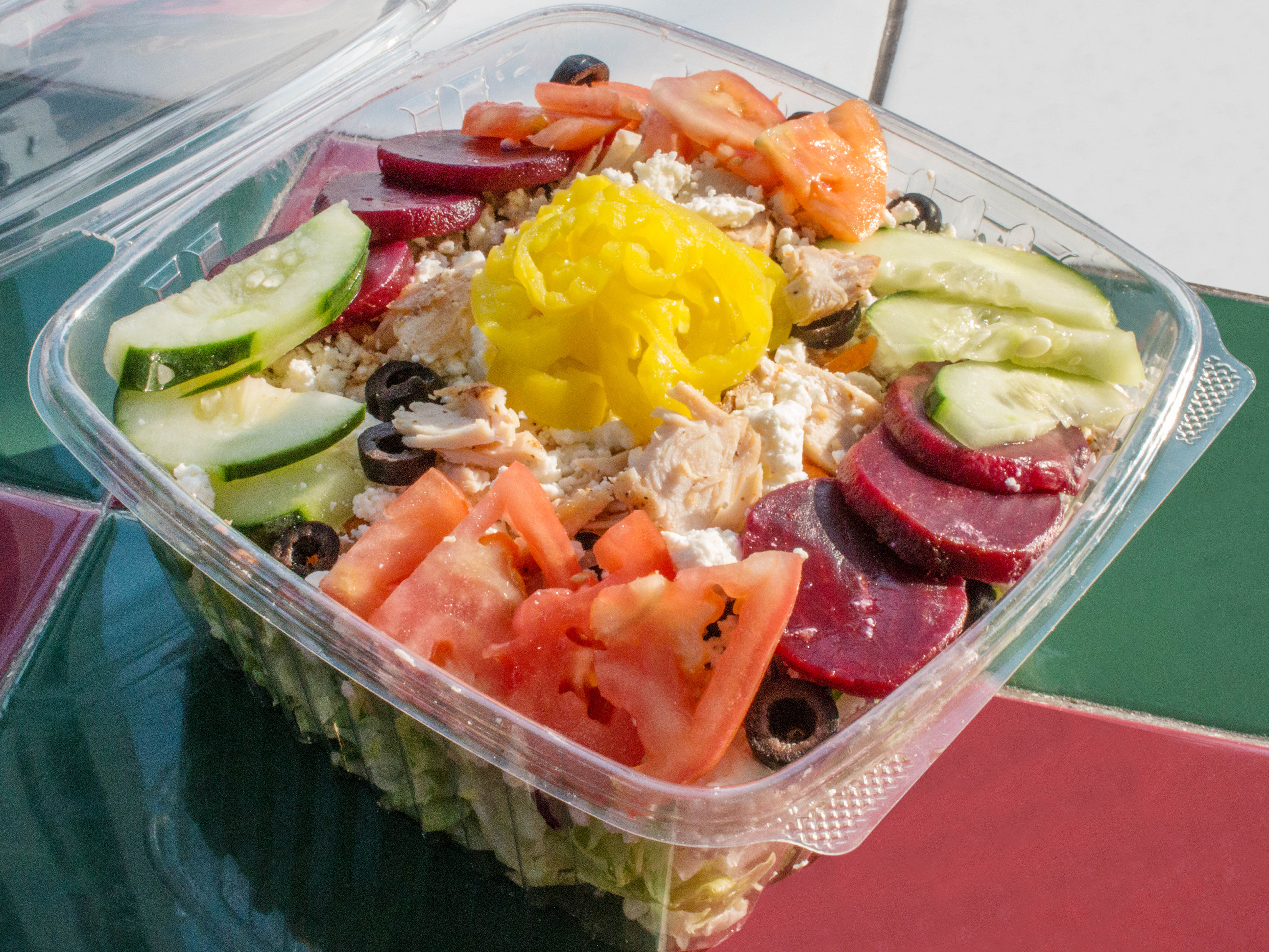 Order Greek Salad food online from Amiccis Pizza store, Detroit on bringmethat.com