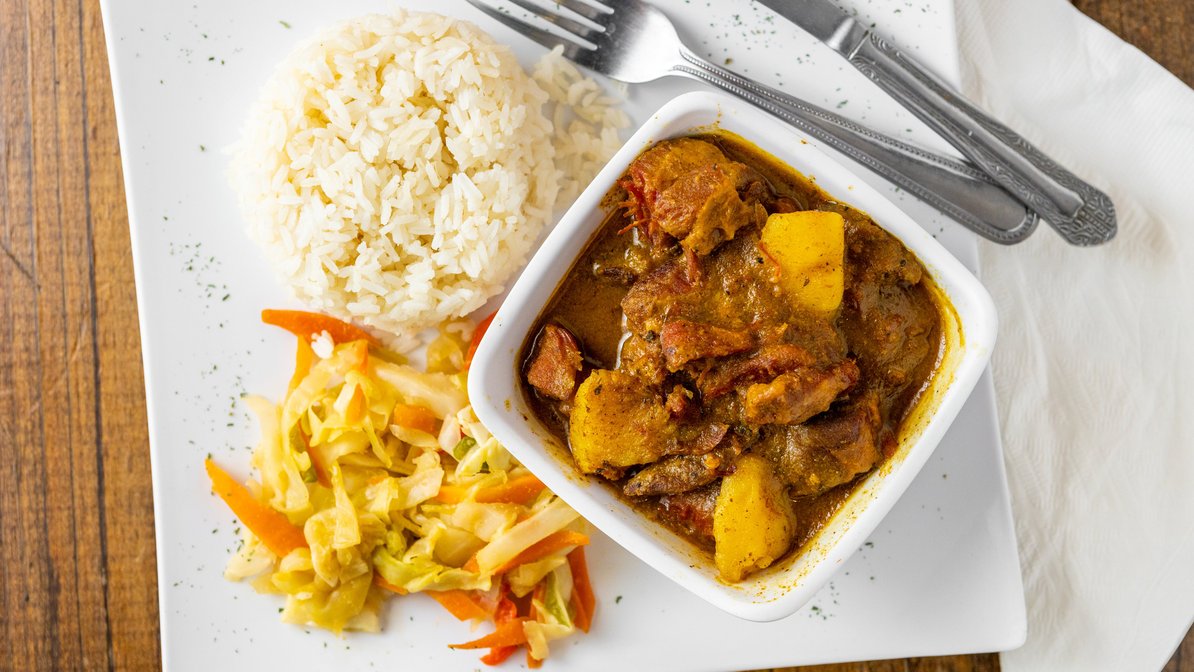 Order Curry Goat food online from The Island Spot store, Dallas on bringmethat.com
