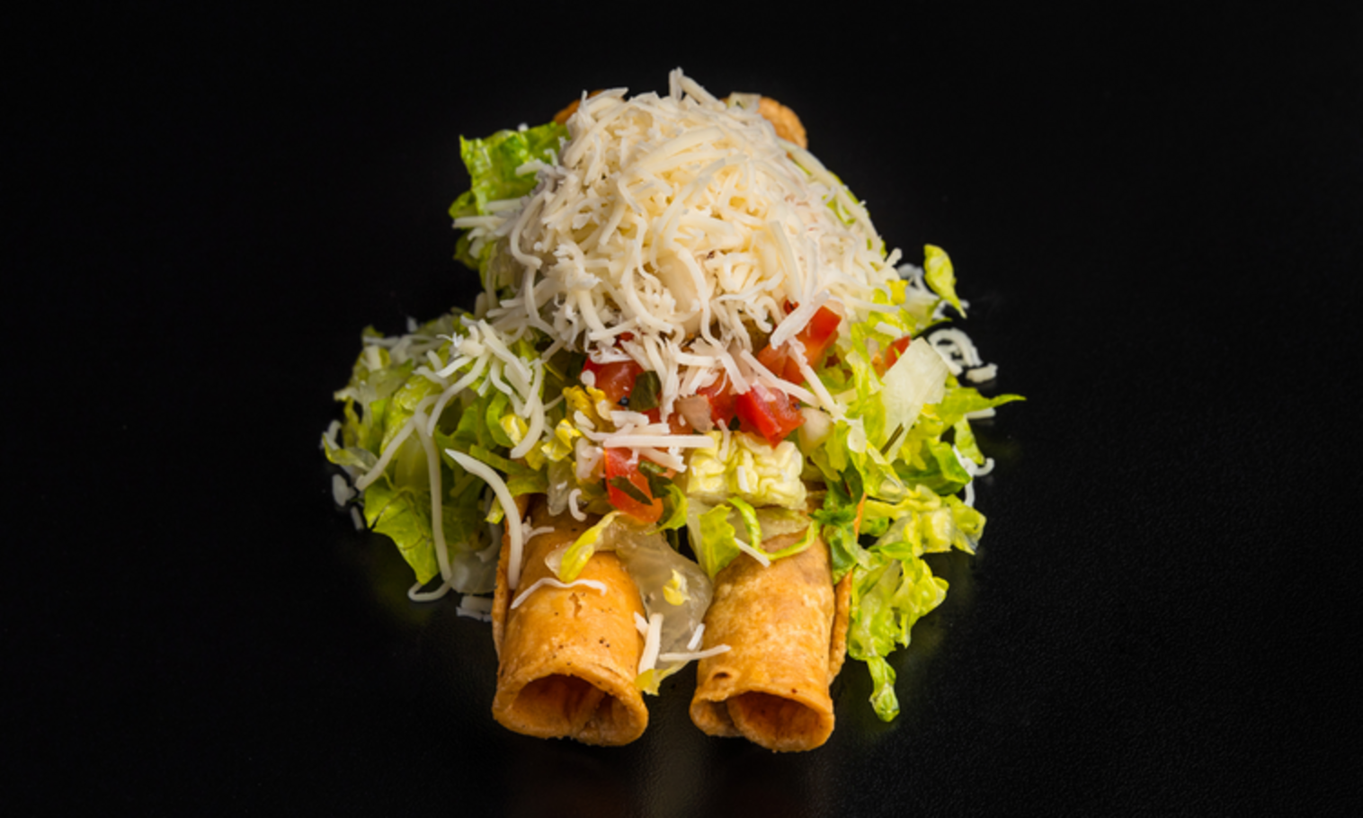 Order 2 Rolled Tacos food online from Lucha Libre Taco Shop store, San Diego on bringmethat.com