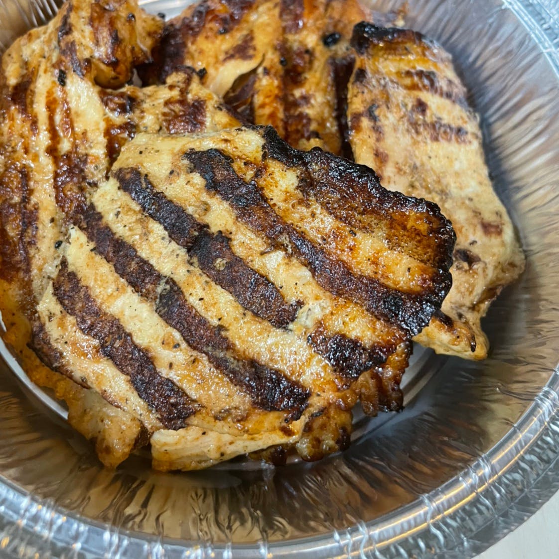 Order Side of Grilled Chicken - Side food online from Davila's Pizza & Restaurant store, Hackettstown on bringmethat.com