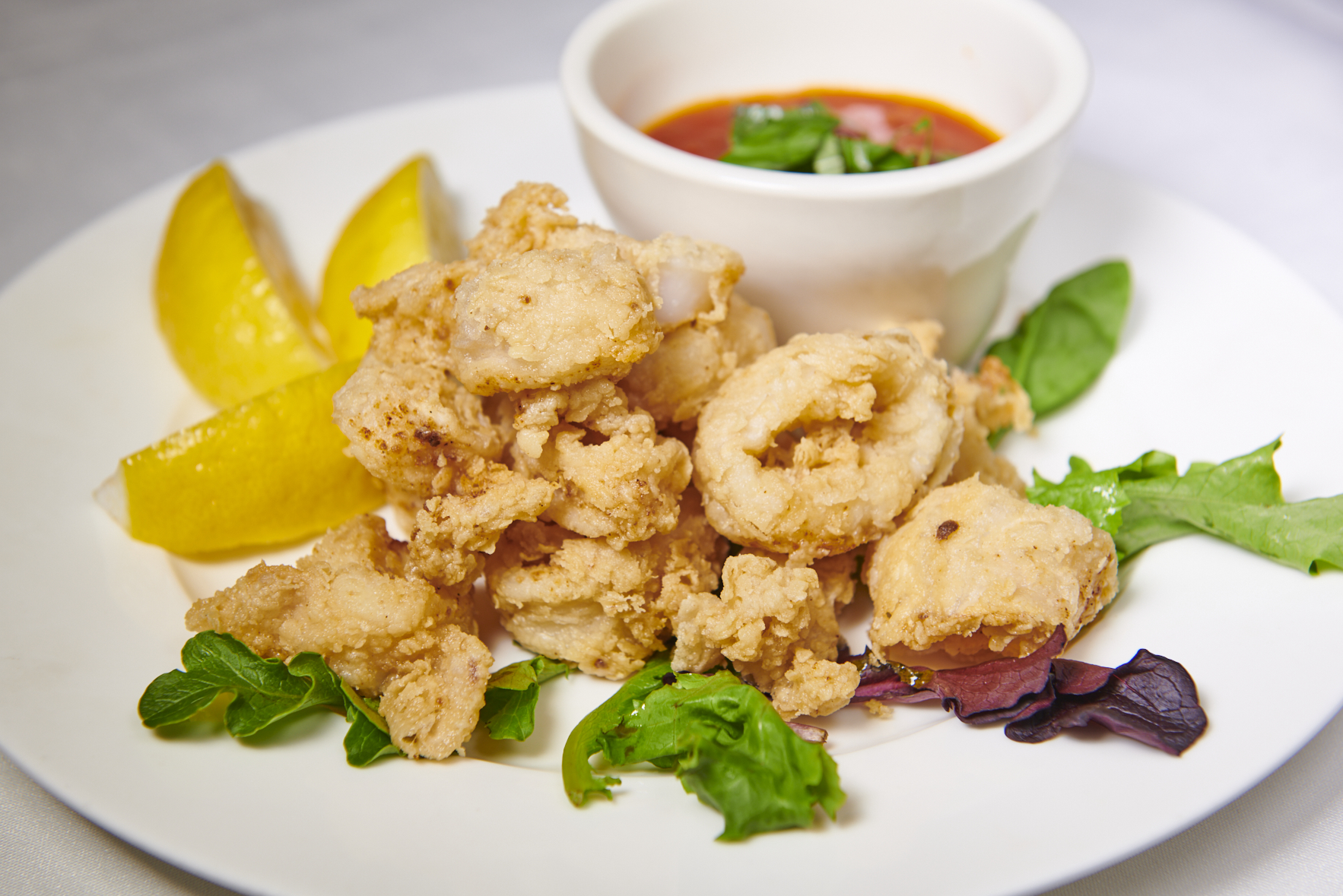 Order Fried Calamari food online from Magno Grill store, New Rochelle on bringmethat.com