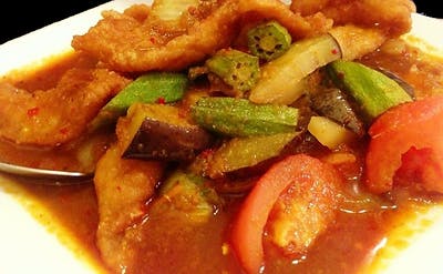 Order F1. Assam Fish Fillet food online from Secret Recipe Asian Bistro store, Plano on bringmethat.com