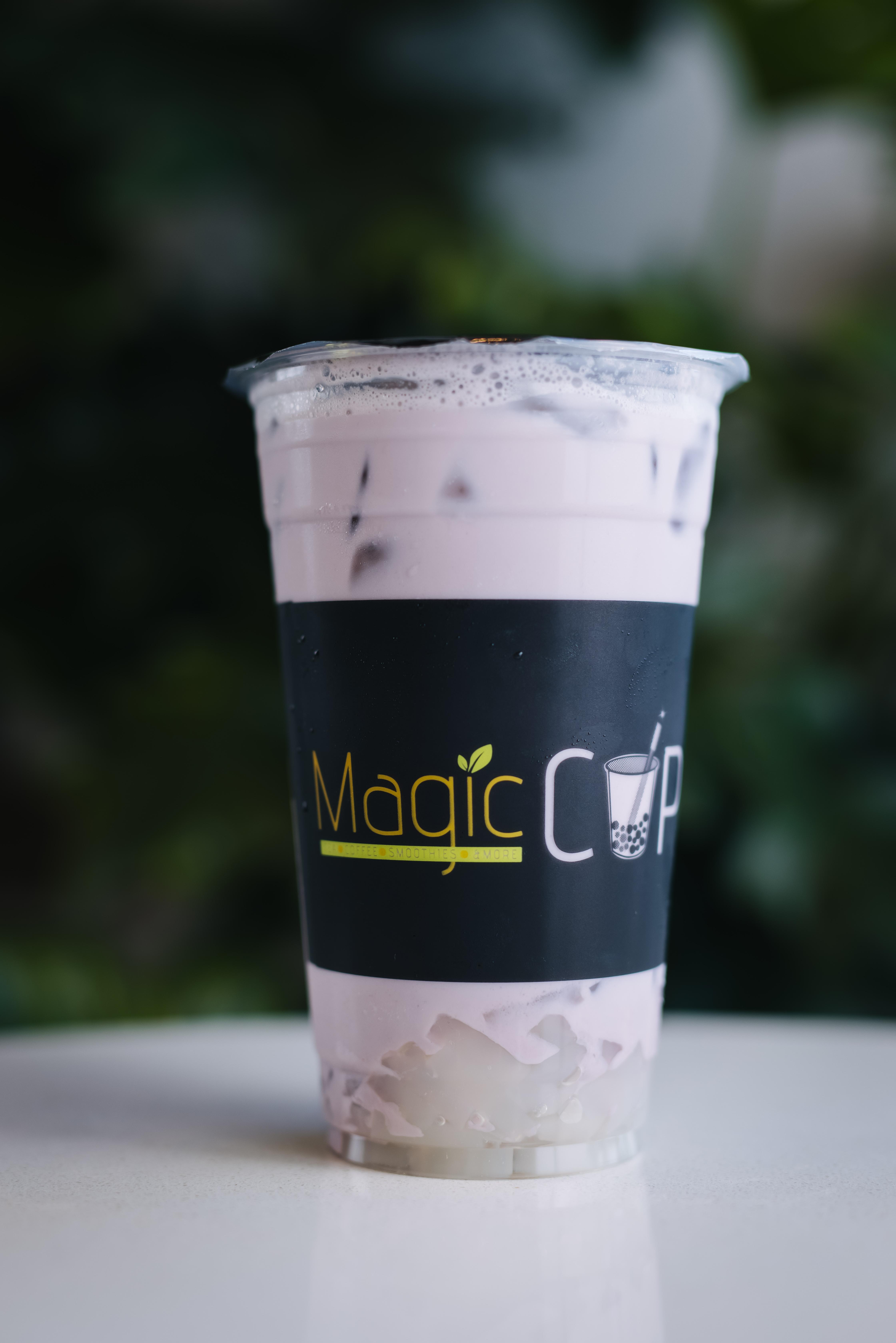 Order Iced Taro Milk Tea w/ Lychee Jelly food online from Magic Cup store, Houston on bringmethat.com